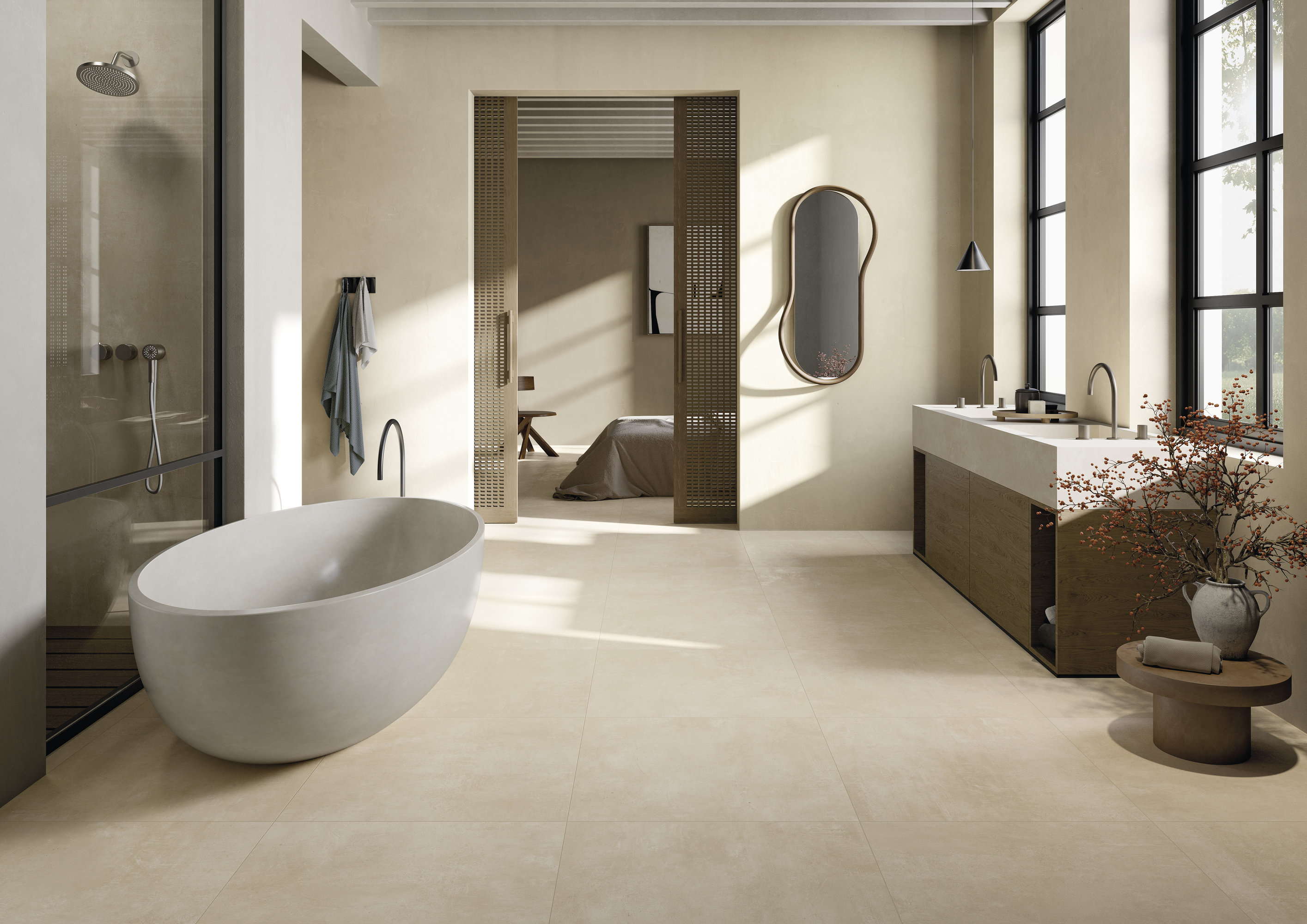 Bright, modern bathroom with large-format floor tiles, freestanding bath and shower.