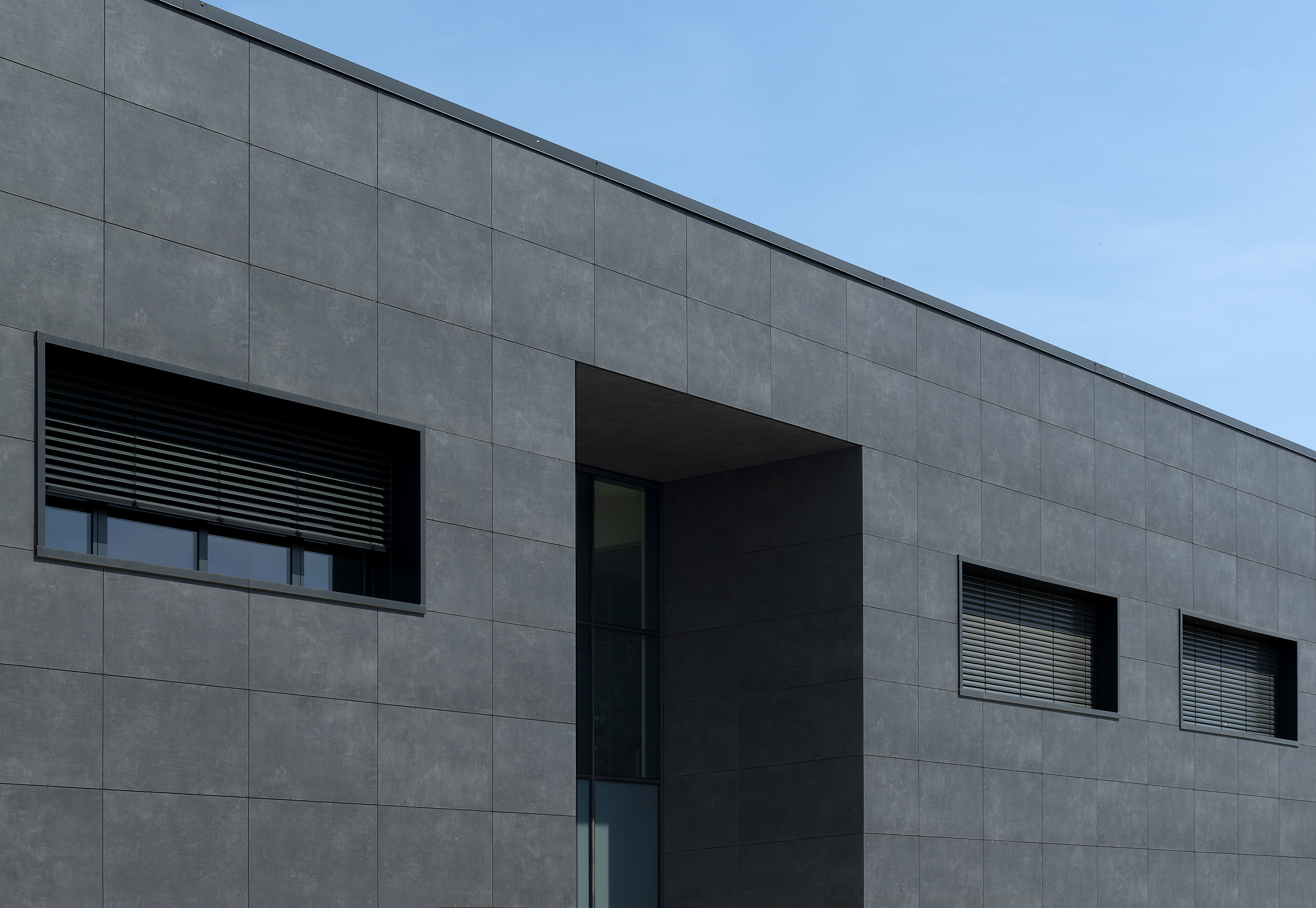 Contemporary building facade with high-quality, large-format outdoor tiles.