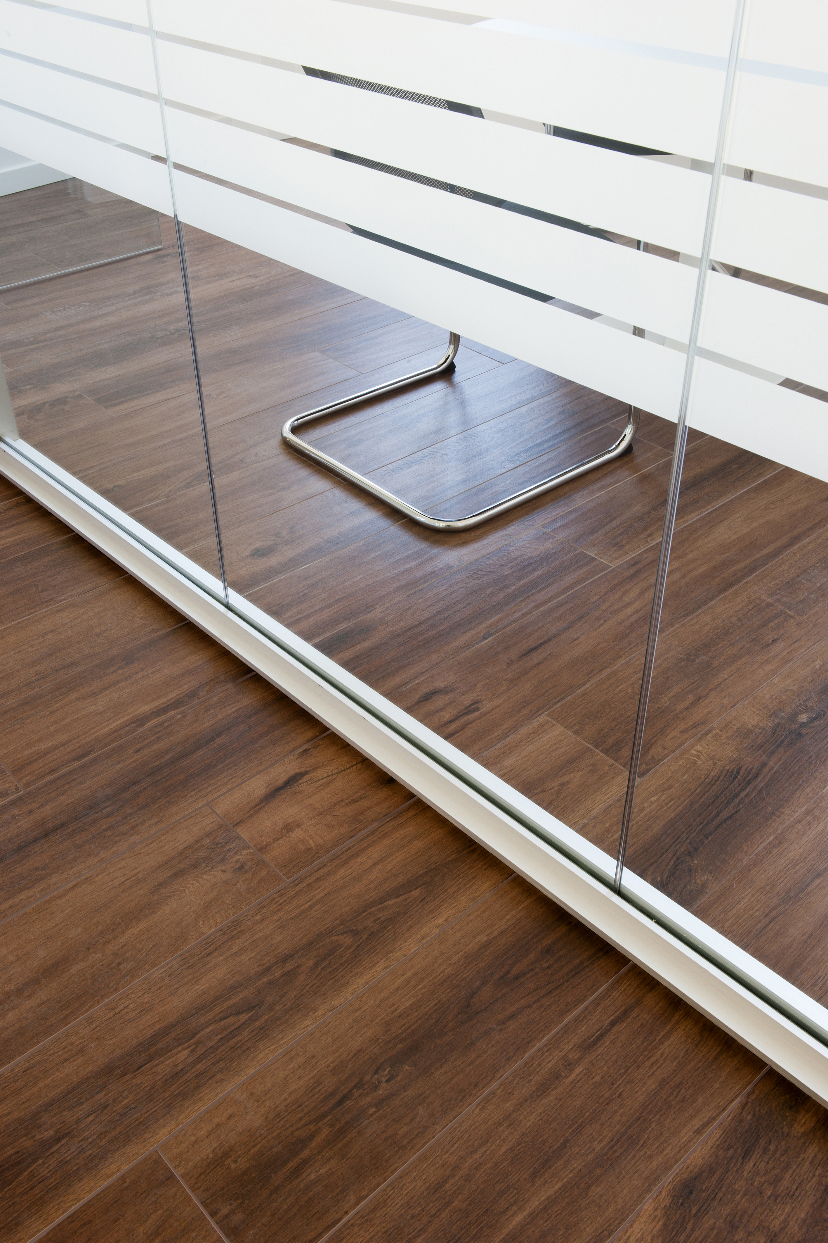 Dark brown wood-effect tiles for stylish interiors.