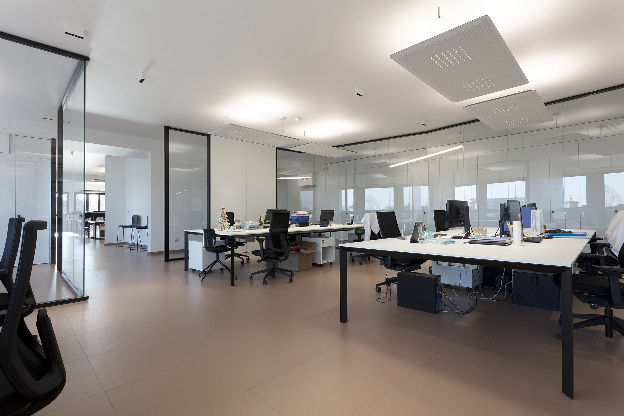 Office with high-quality, light brown indoor tiles that create a modern atmosphere.