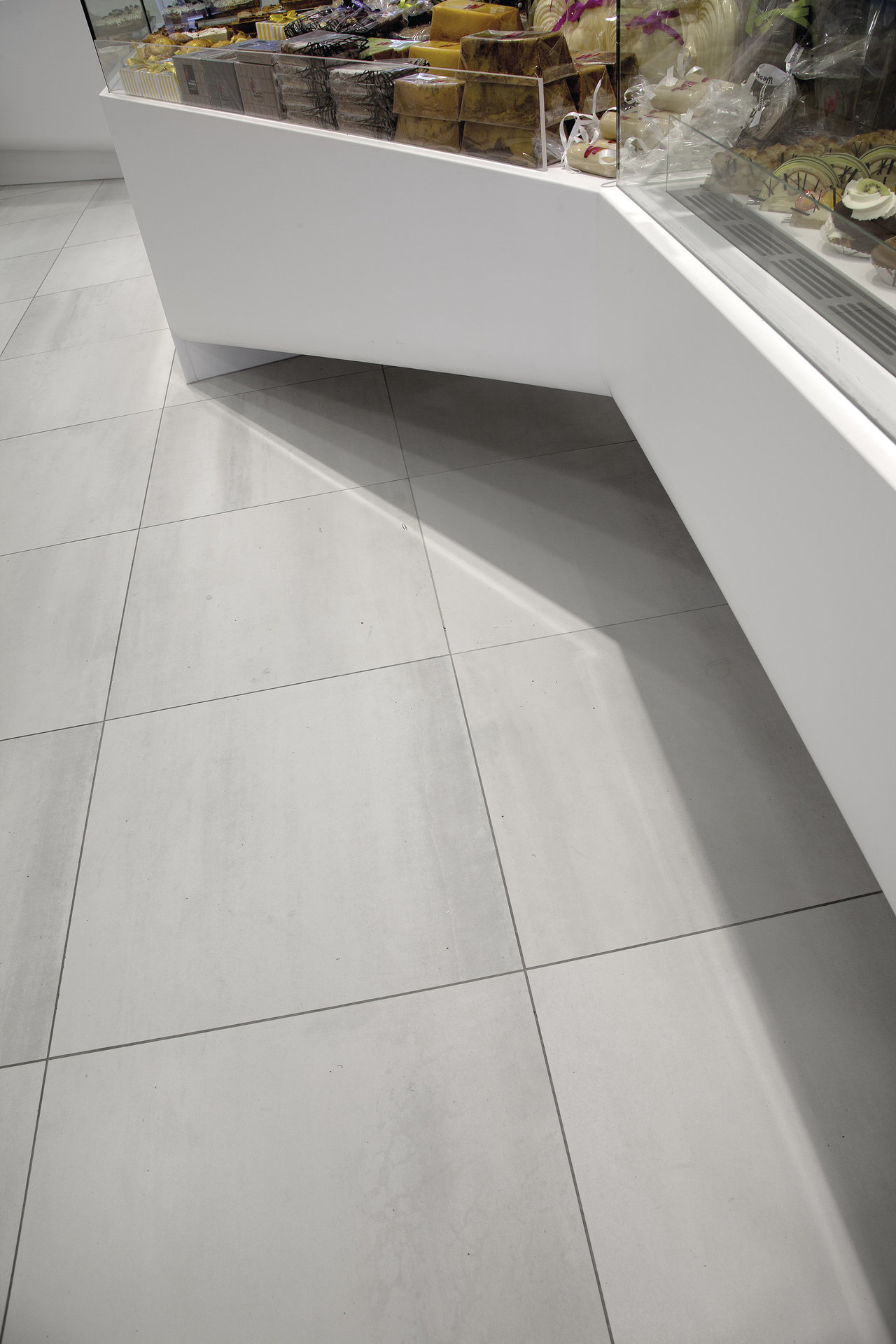 Timeless light grey floor tiles with a fine texture.