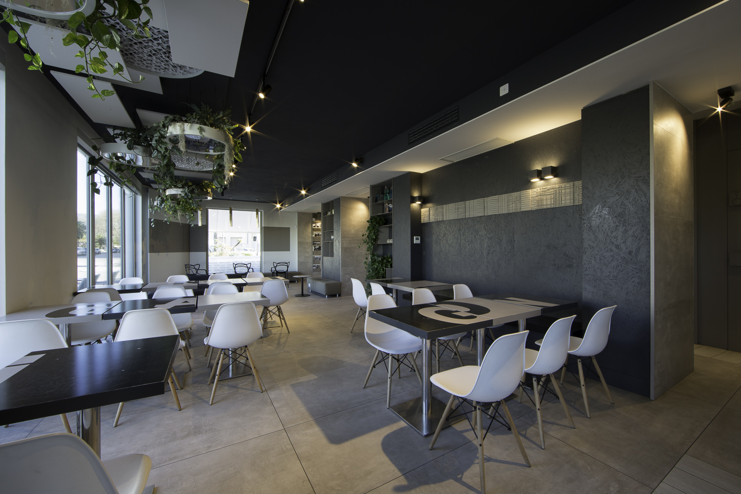 Large-format grey tiles in a modern hospitality area.