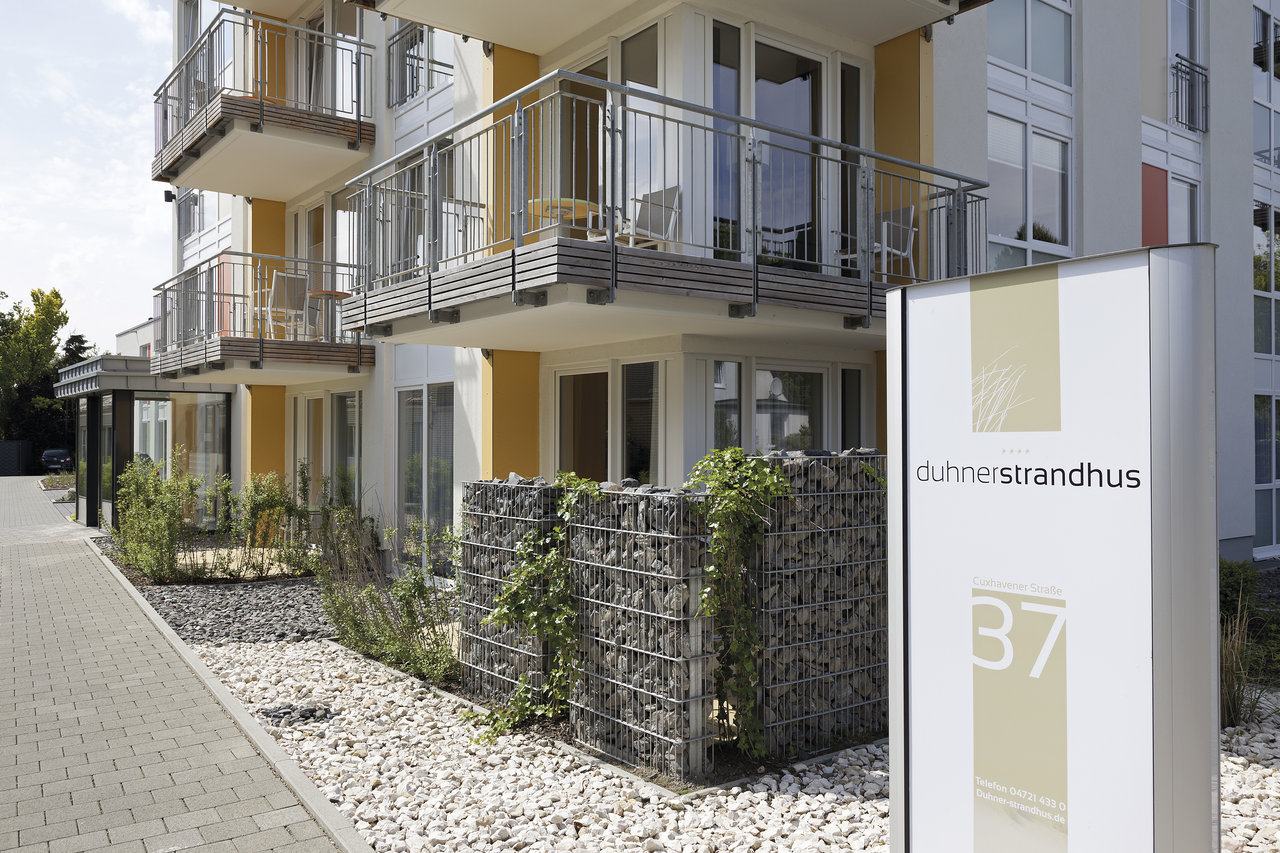 Modern outdoor design with walkway, gravel, and gabions. Outdoor tile inspiration.