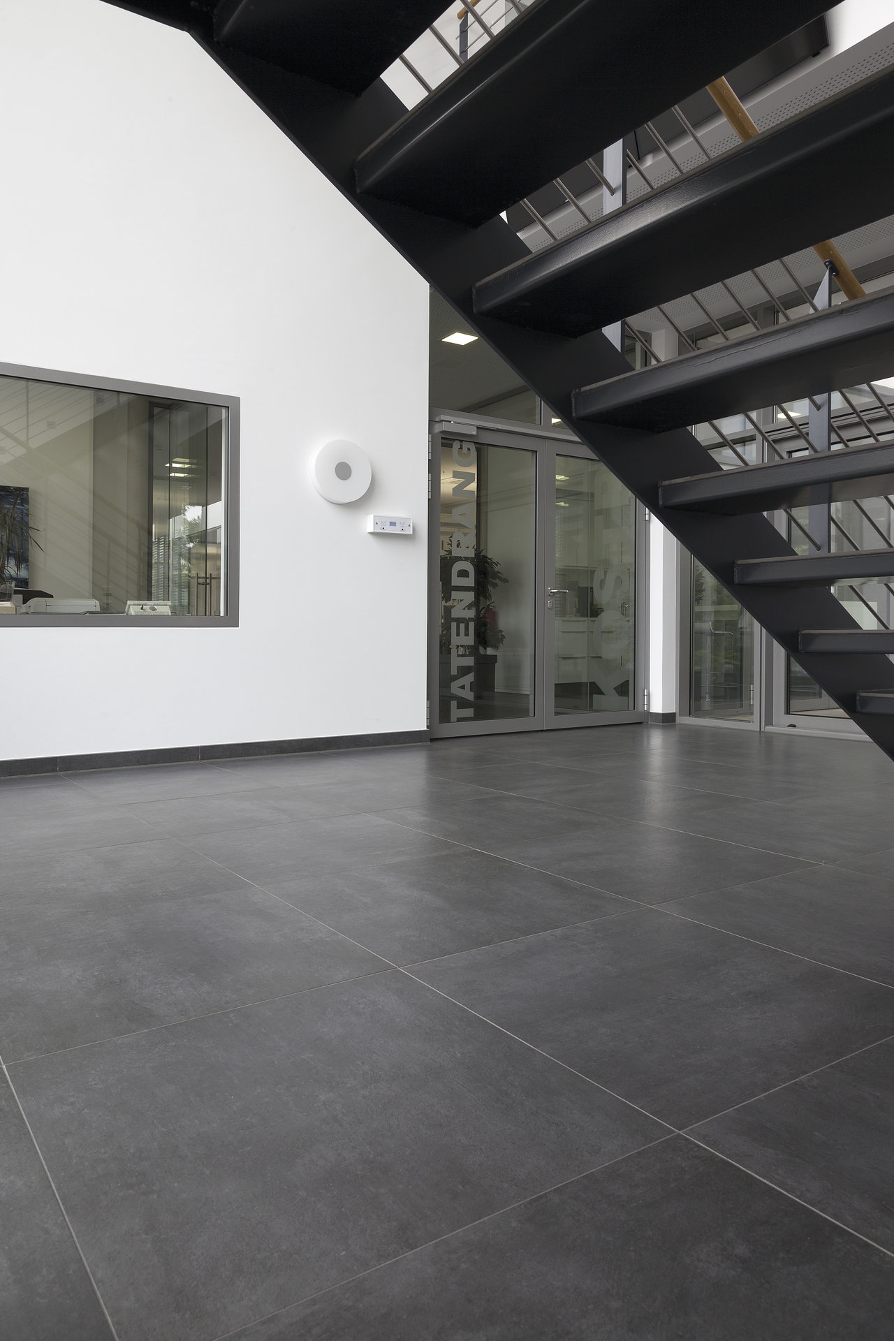 High-quality dark grey large-format tiles for modern interiors.