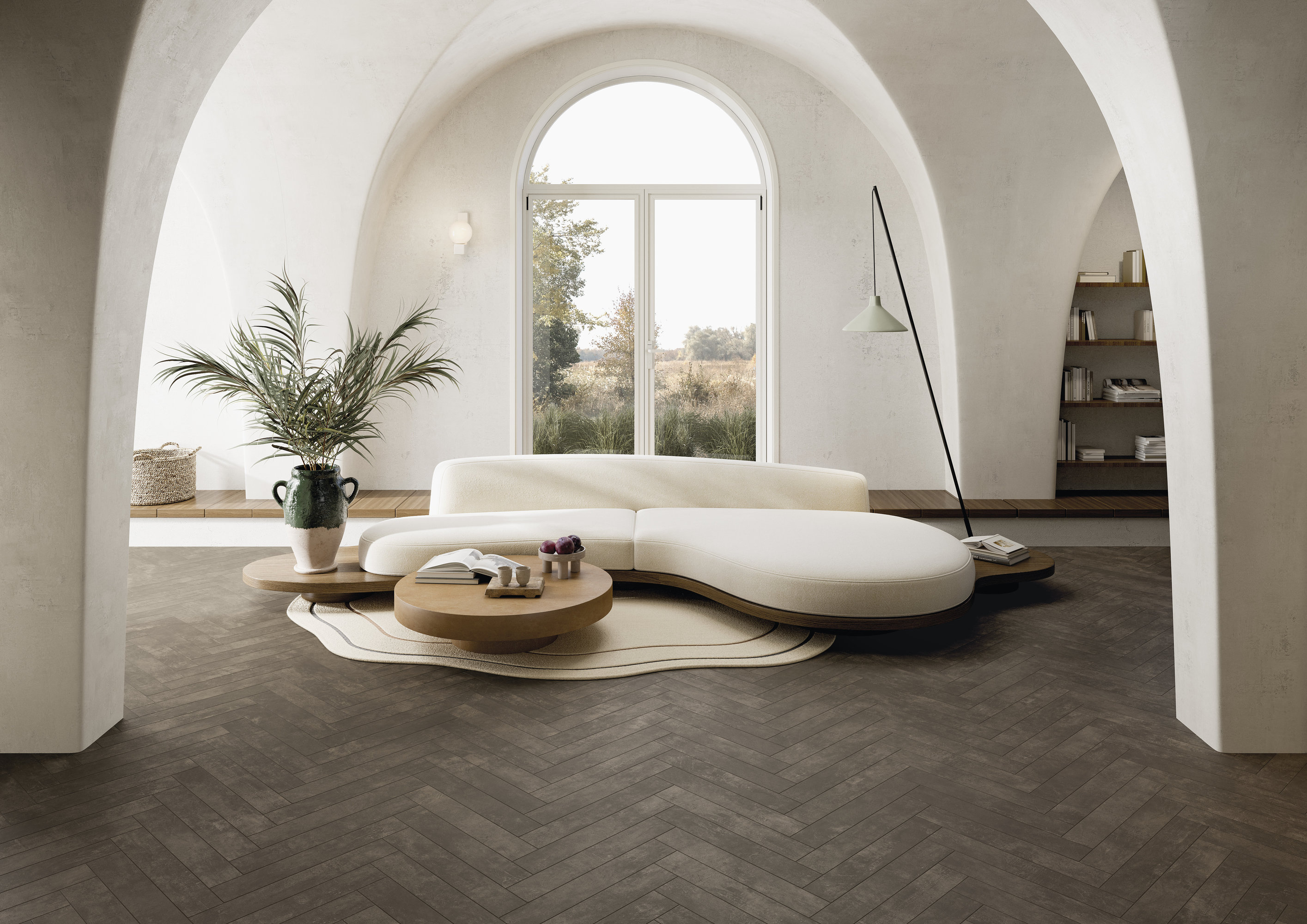 Dark herringbone tiled floor in a bright, modern living room.