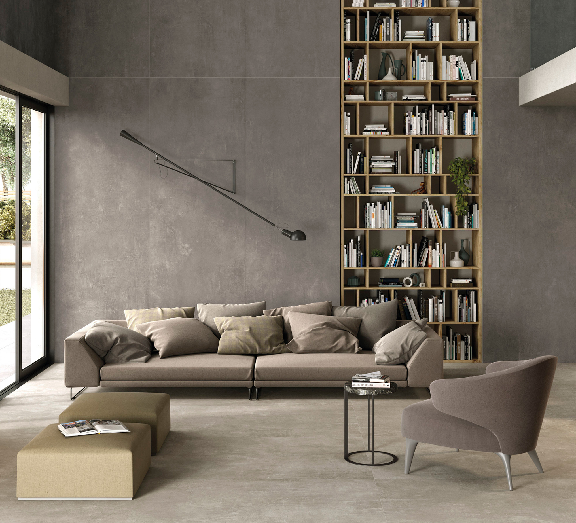 Modern living room with large concrete-effect wall and floor tiles.