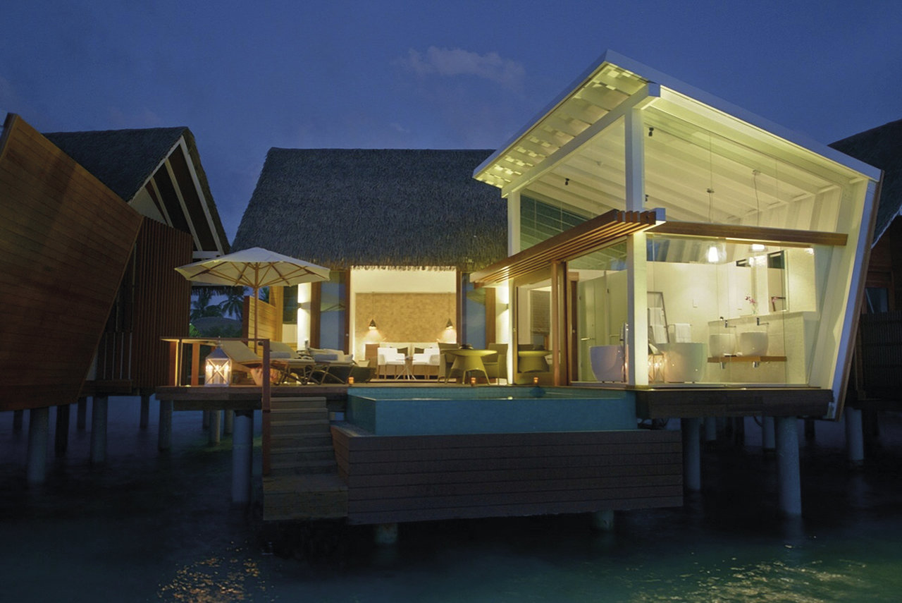 Luxurious overwater villa with modern bathroom and terrace, perfect for high-quality tiles.