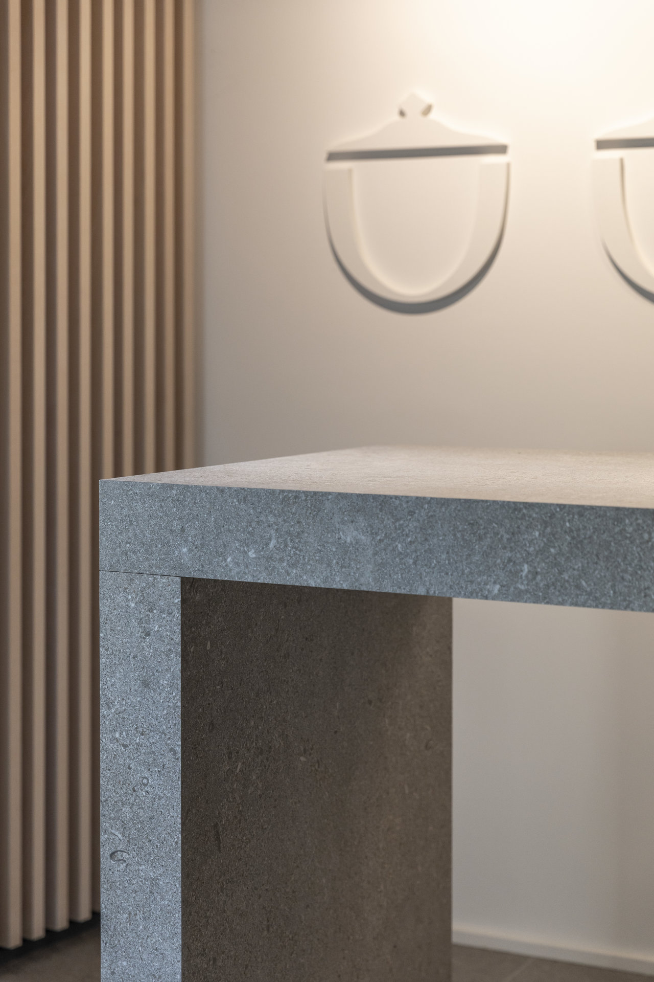 Modern table made of robust porcelain stoneware tiles in dark grey.