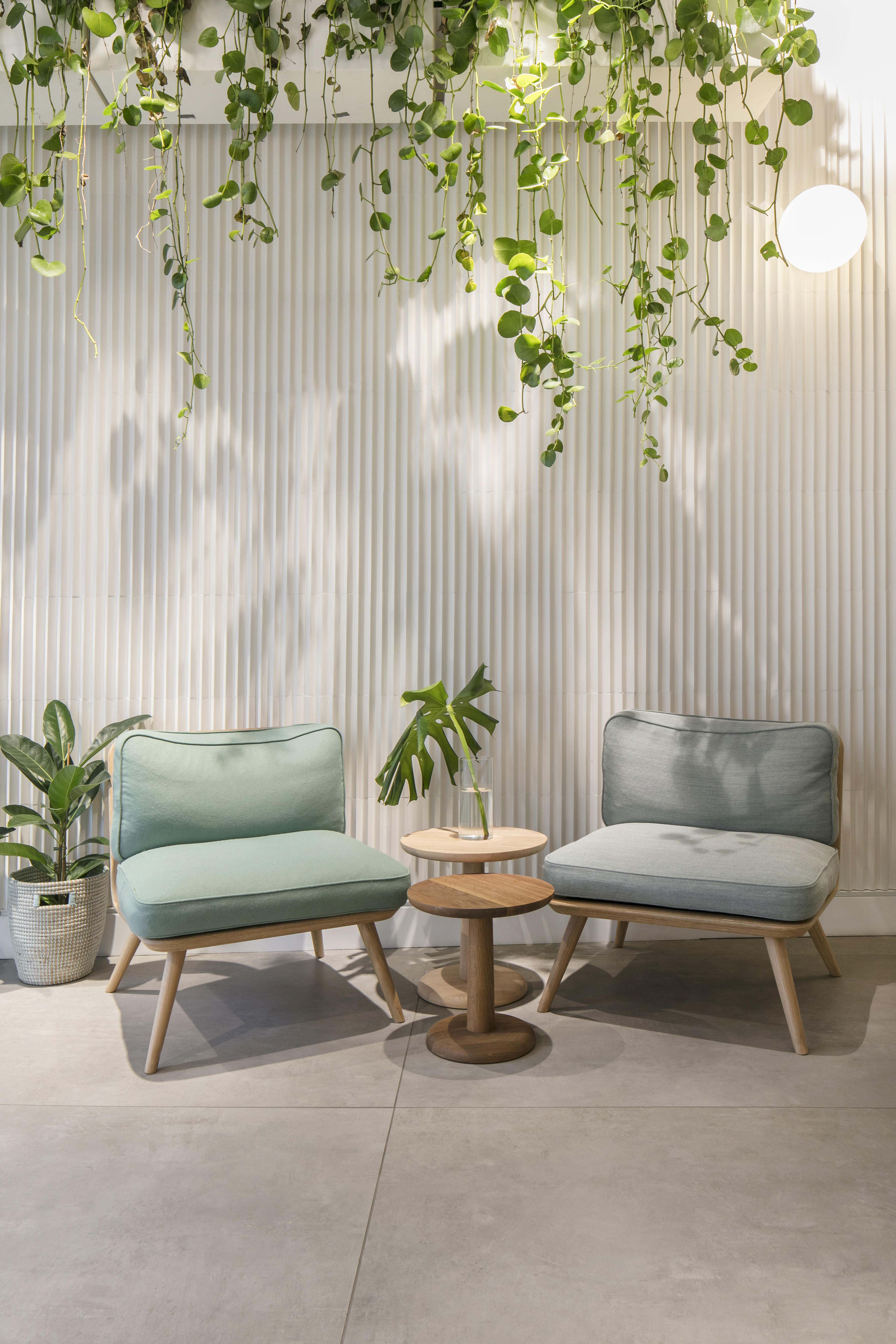 Modern, light grey, large format indoor porcelain tiles.