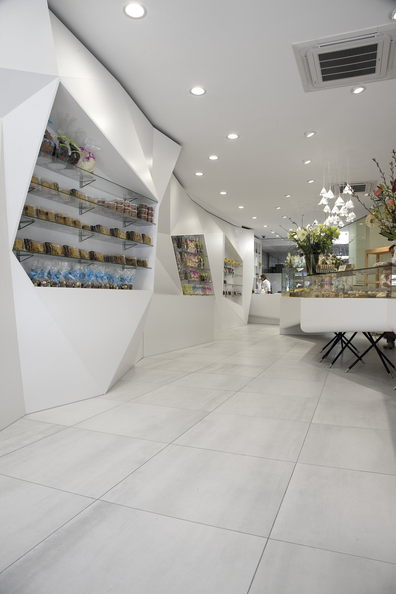 Bright, large-format floor tiles in a modern store setting.