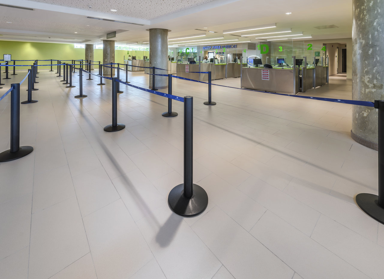 High-quality, light-colored large-format tiles in a modern reception area.