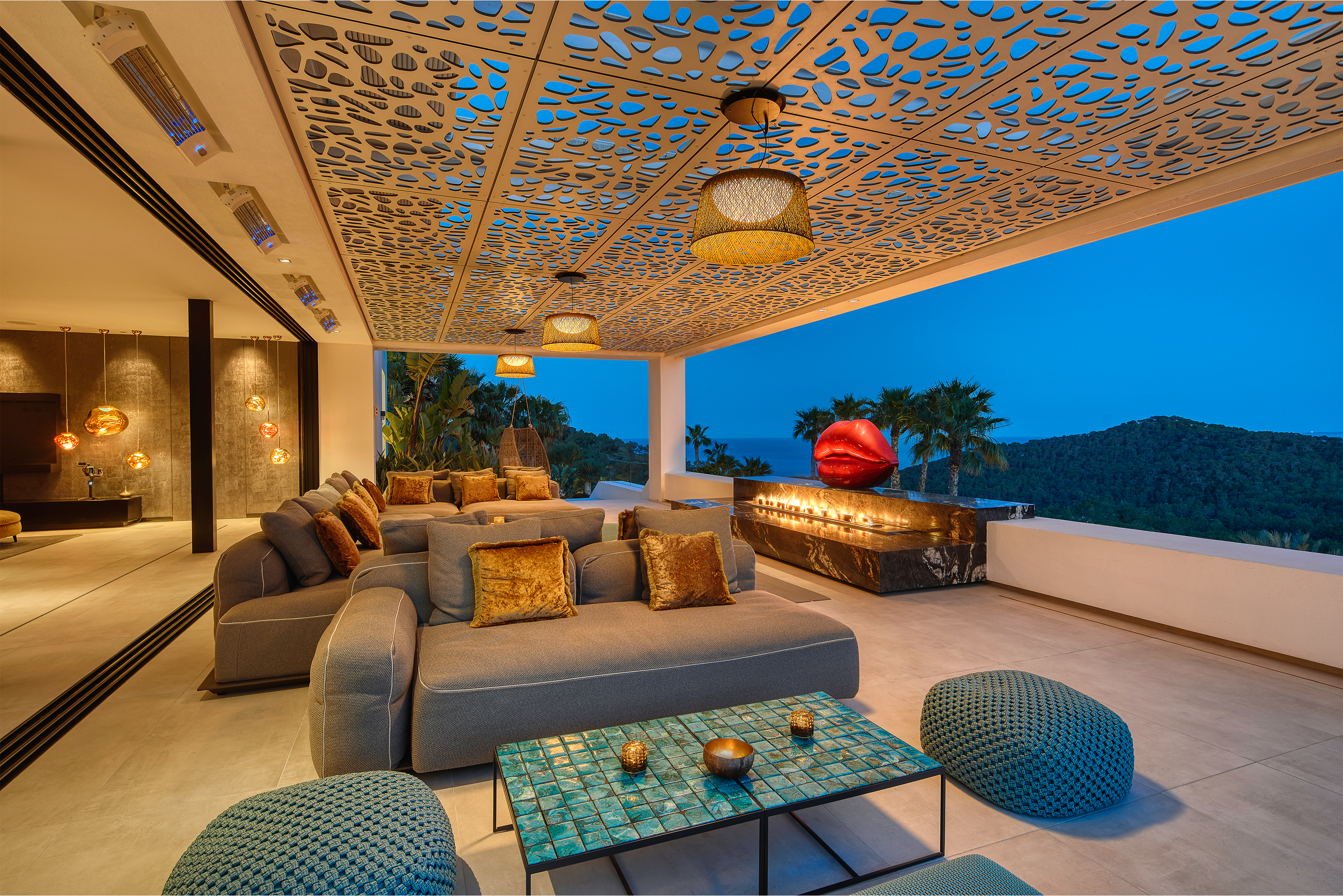 Stylish outdoor lounge with high-quality outdoor tiles and panoramic view.