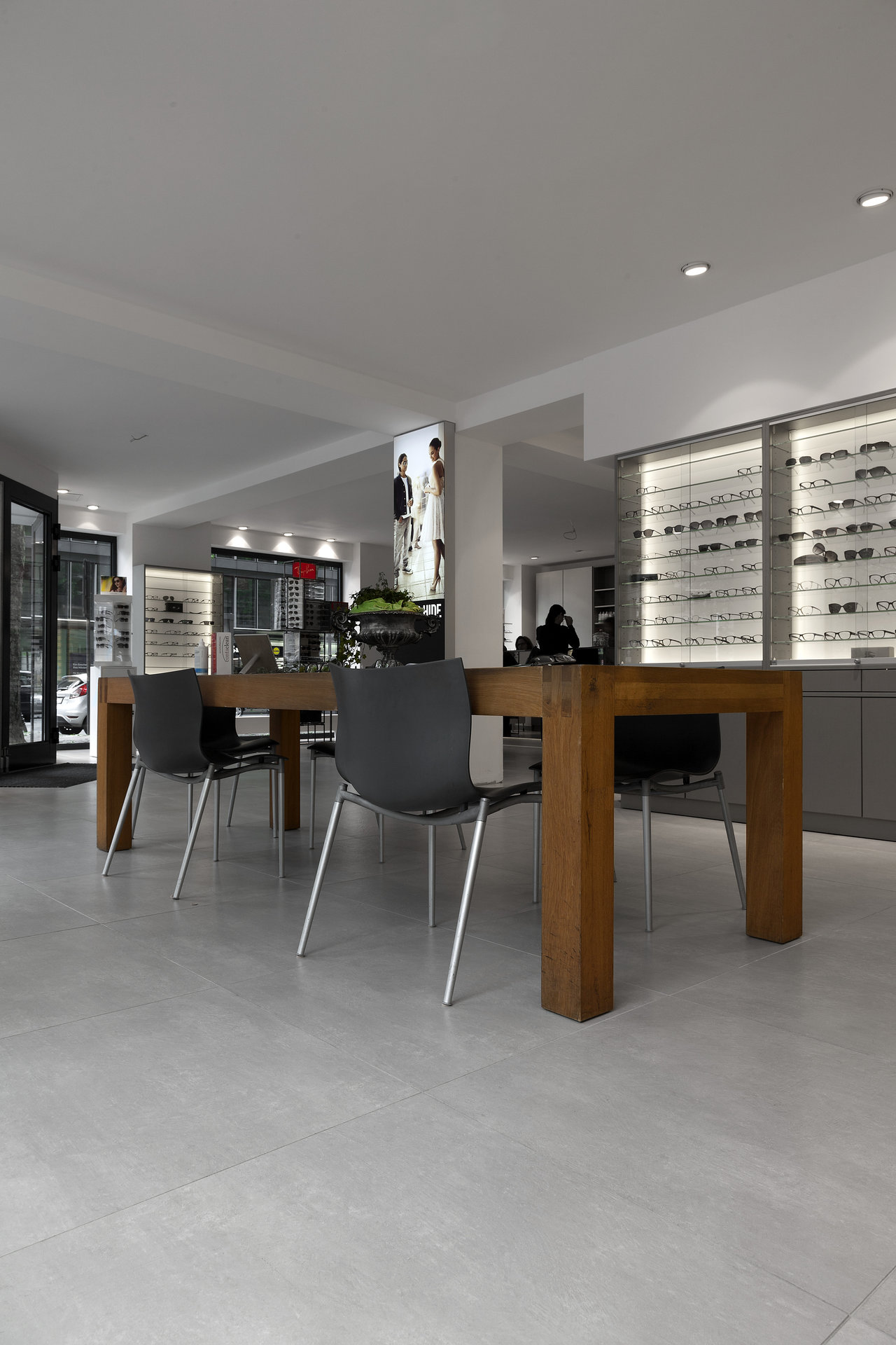 Large-format, light grey indoor floor tiles with a modern design.