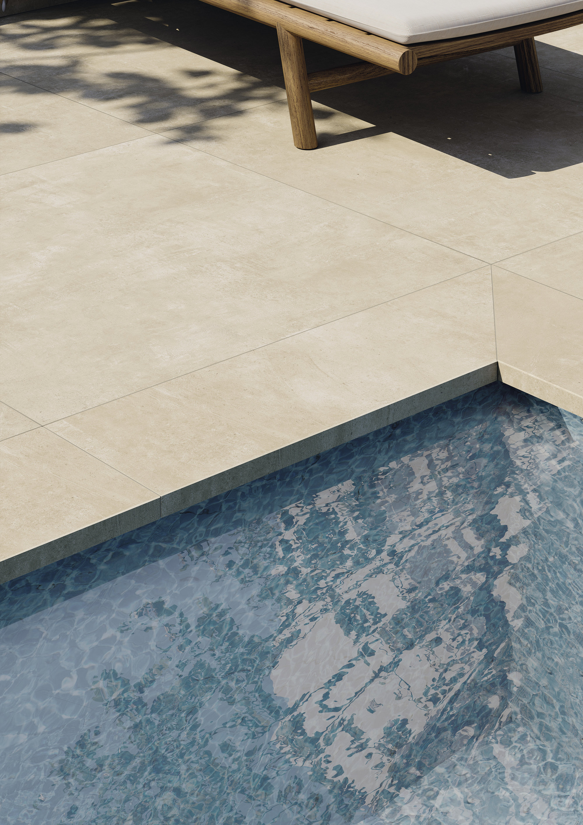 High-quality outdoor tiles by the pool with sun lounger.