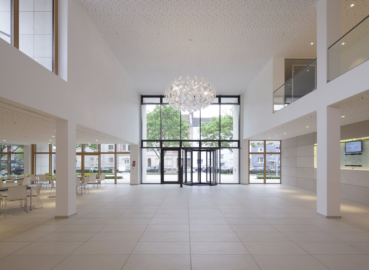 Bright, large indoor tiles in a modern reception area.