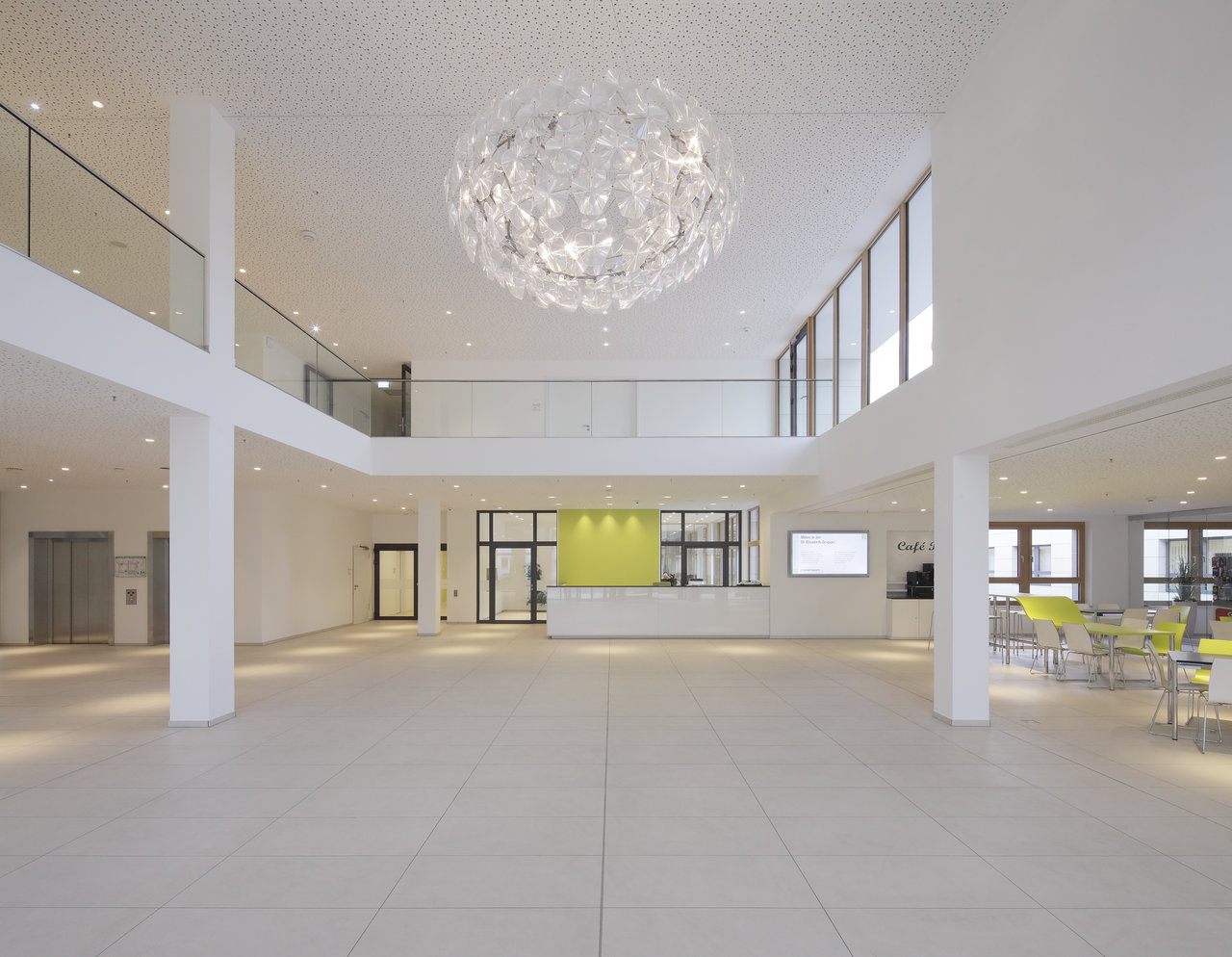 Bright, large-format tiles in a modern foyer.