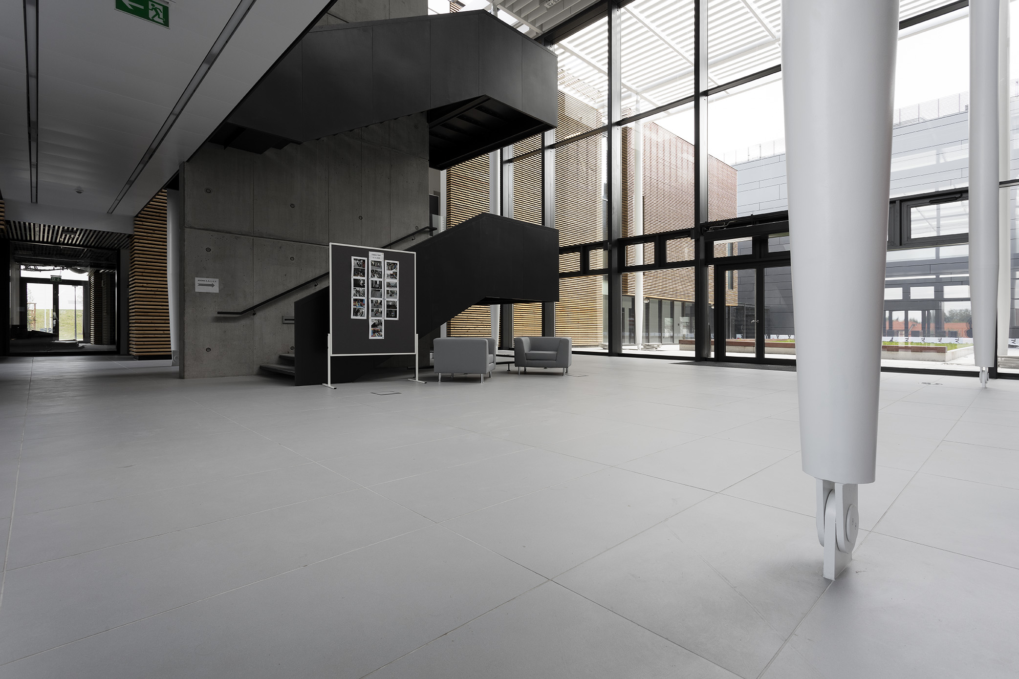 Light, large-format tiles in a modern, spacious interior.