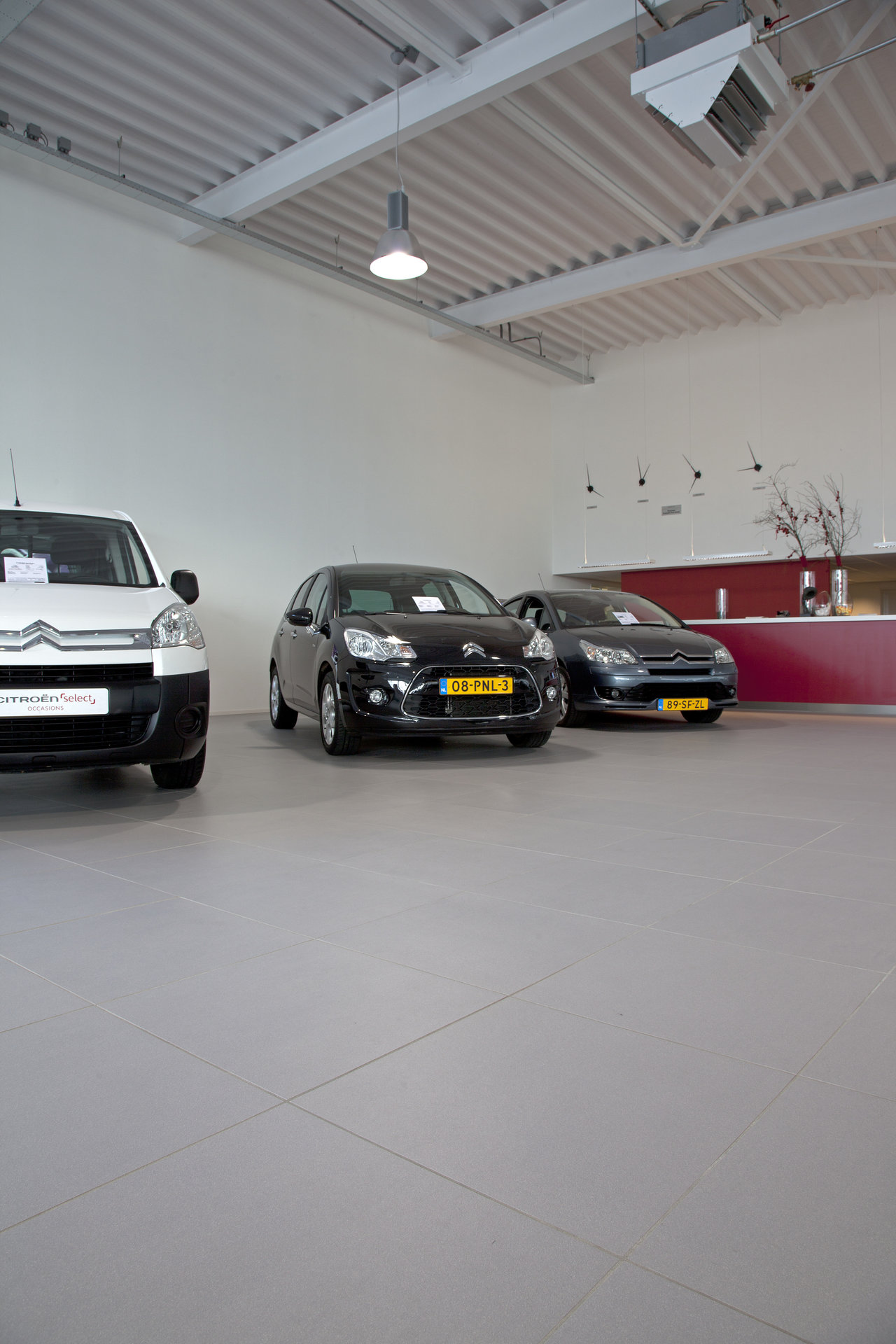 Light, large-format tiled floor in a modern interior.