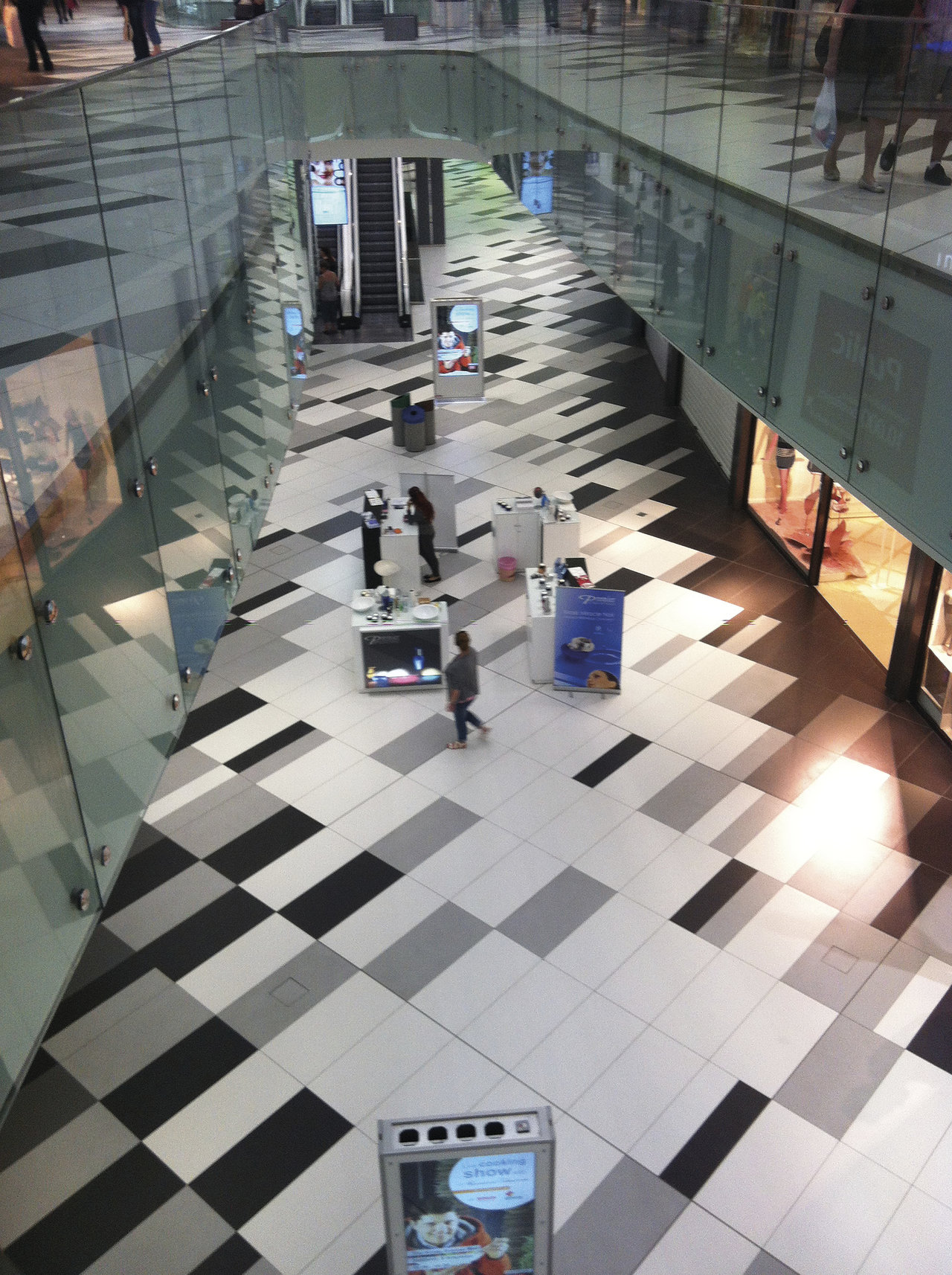 High-quality black, grey & white indoor tile floor with modern pattern.