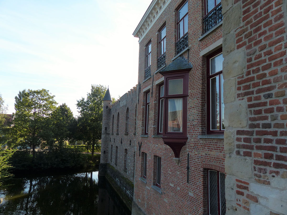 Picturesque brick building with a bay window over a watercourse.