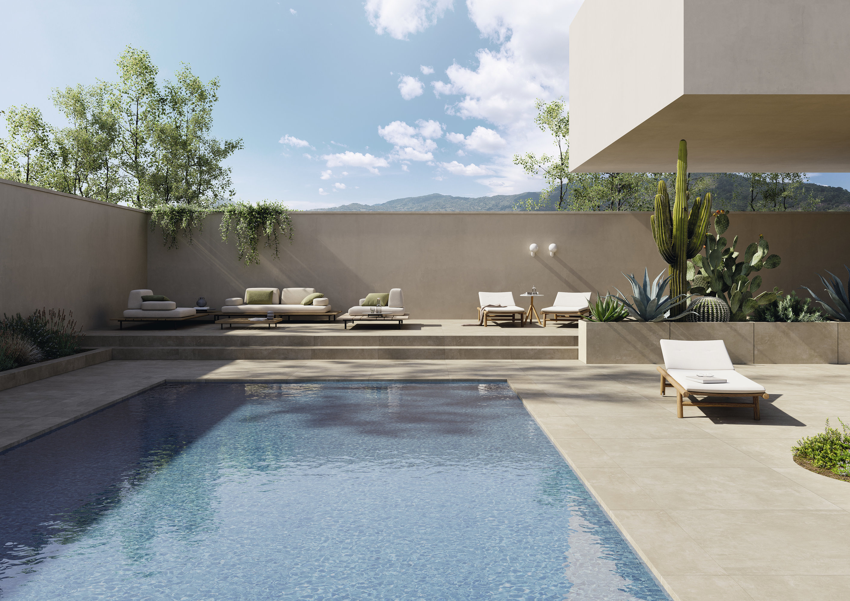 Modern pool terrace with Porcelaingres outdoor tiles and elegant furnishing.