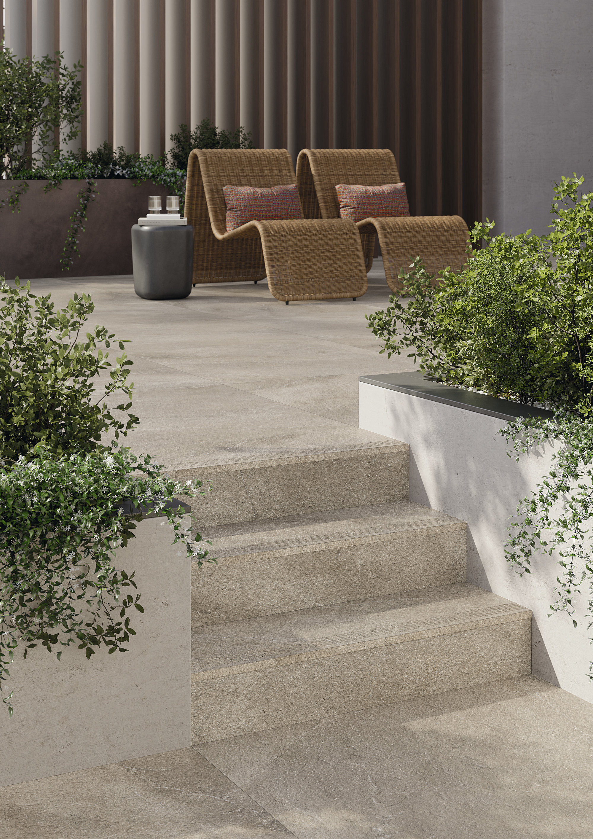 Light stone-look tiles on a modern terrace with stairs and lounge furniture.