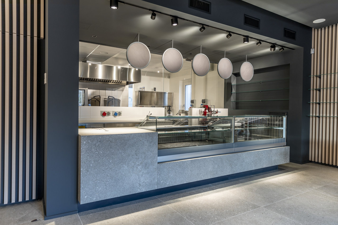 Elegant grey tiles on floor and countertop in a modern setting.