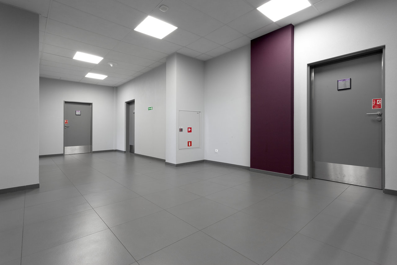 Modern hallway with high-quality grey floor tiles.