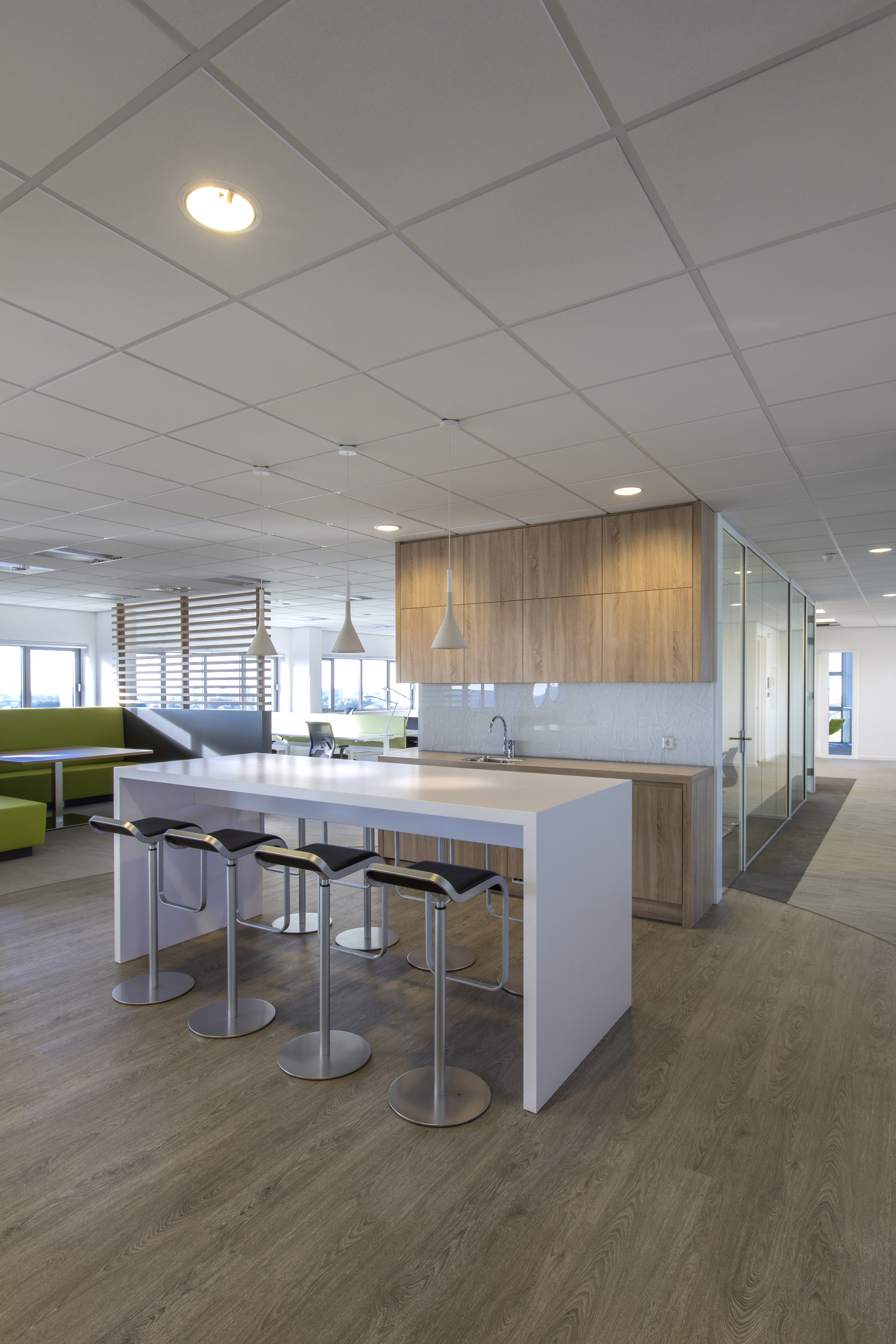 Modern wood-look tiles in office with kitchen island and seating.