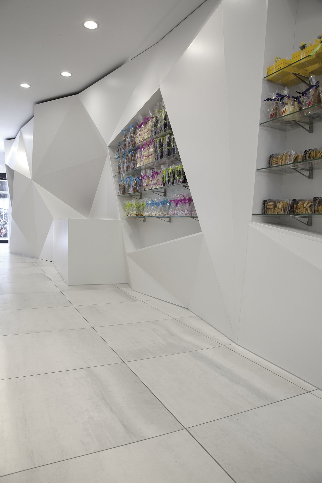 Modern, bright large-format tiles on a stylish showroom floor.