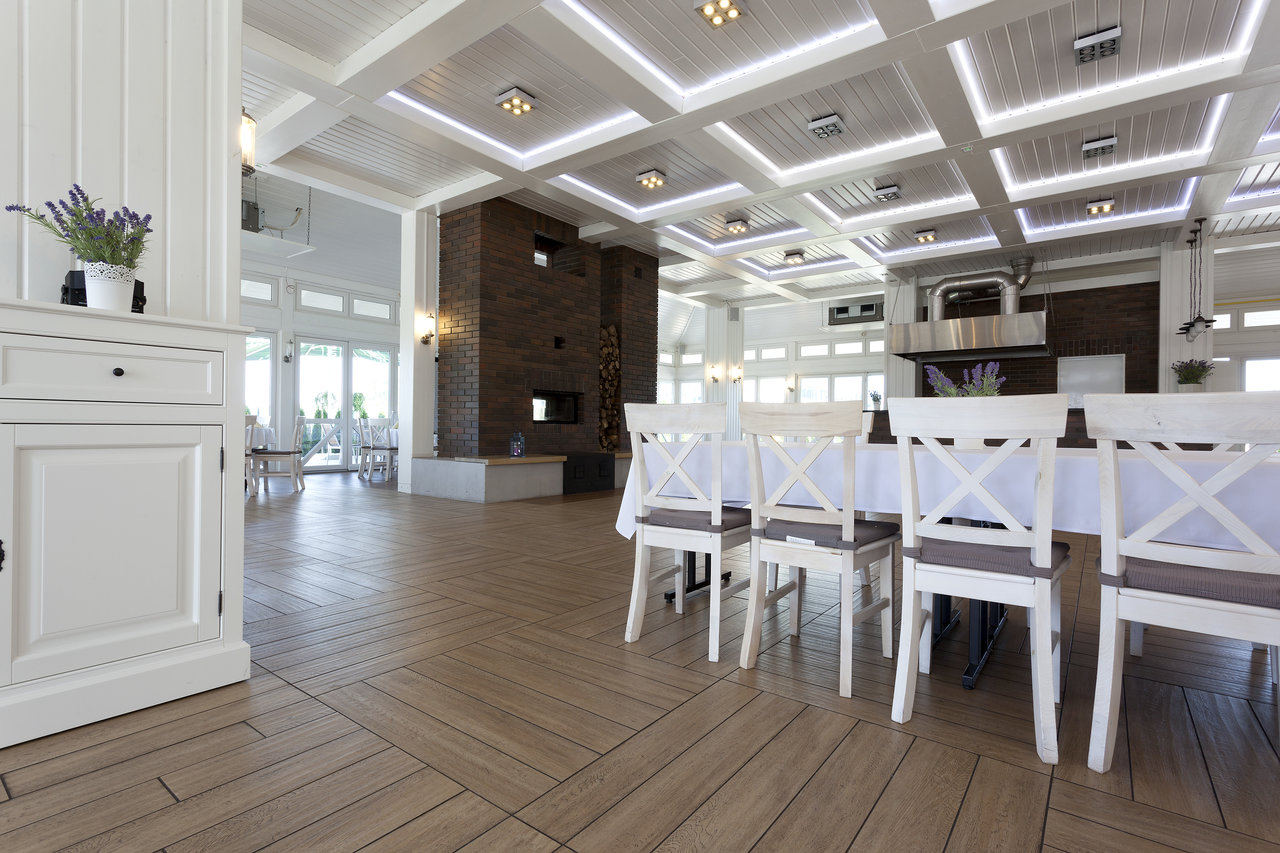 Bright, elegant room with premium wood-effect herringbone tiles.