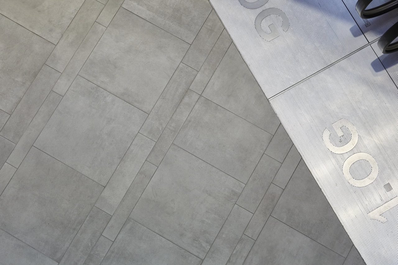 Premium grey concrete-effect tiles with modern pattern.