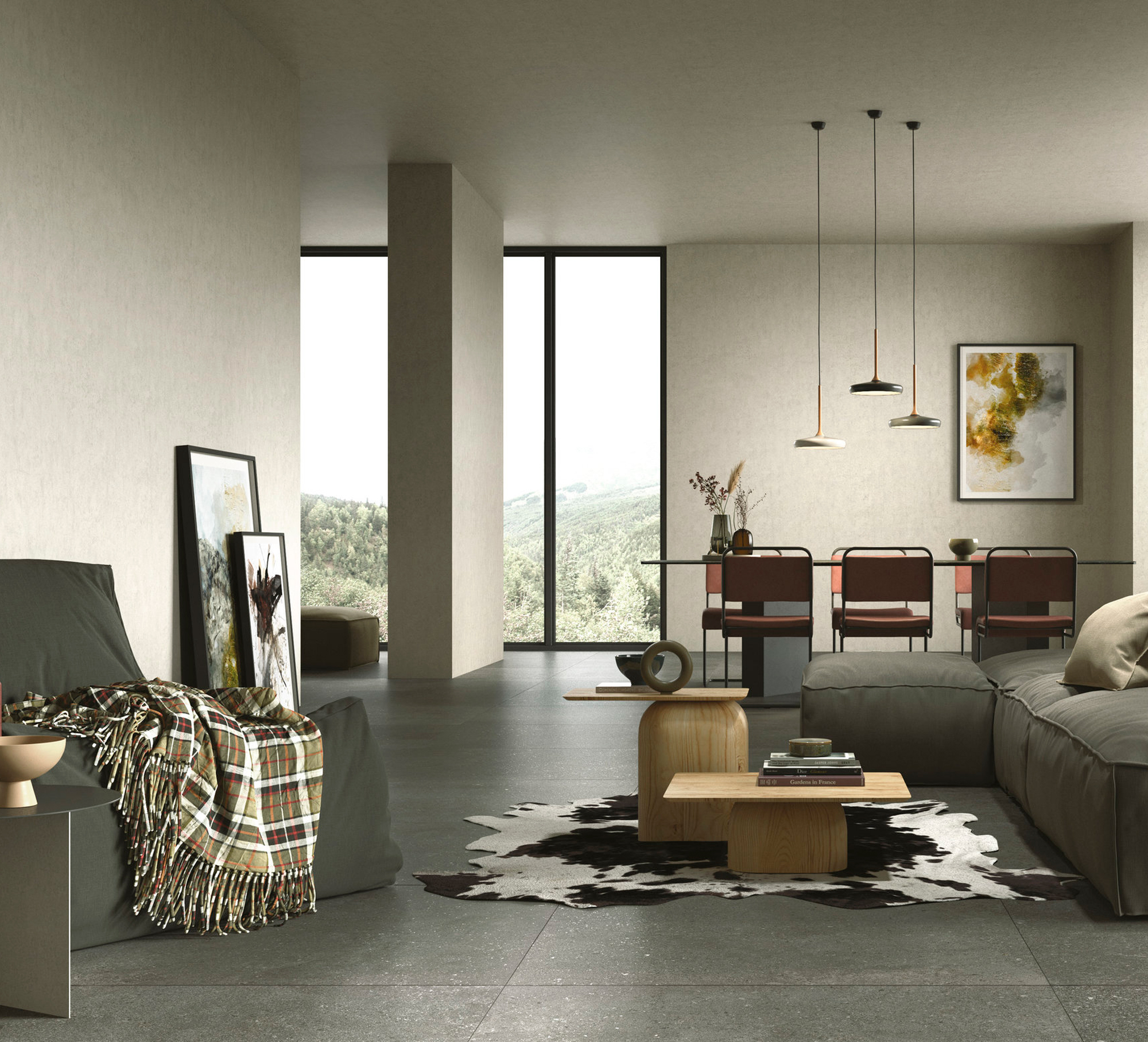 Elegant living area with large dark grey tiles and a view of nature.