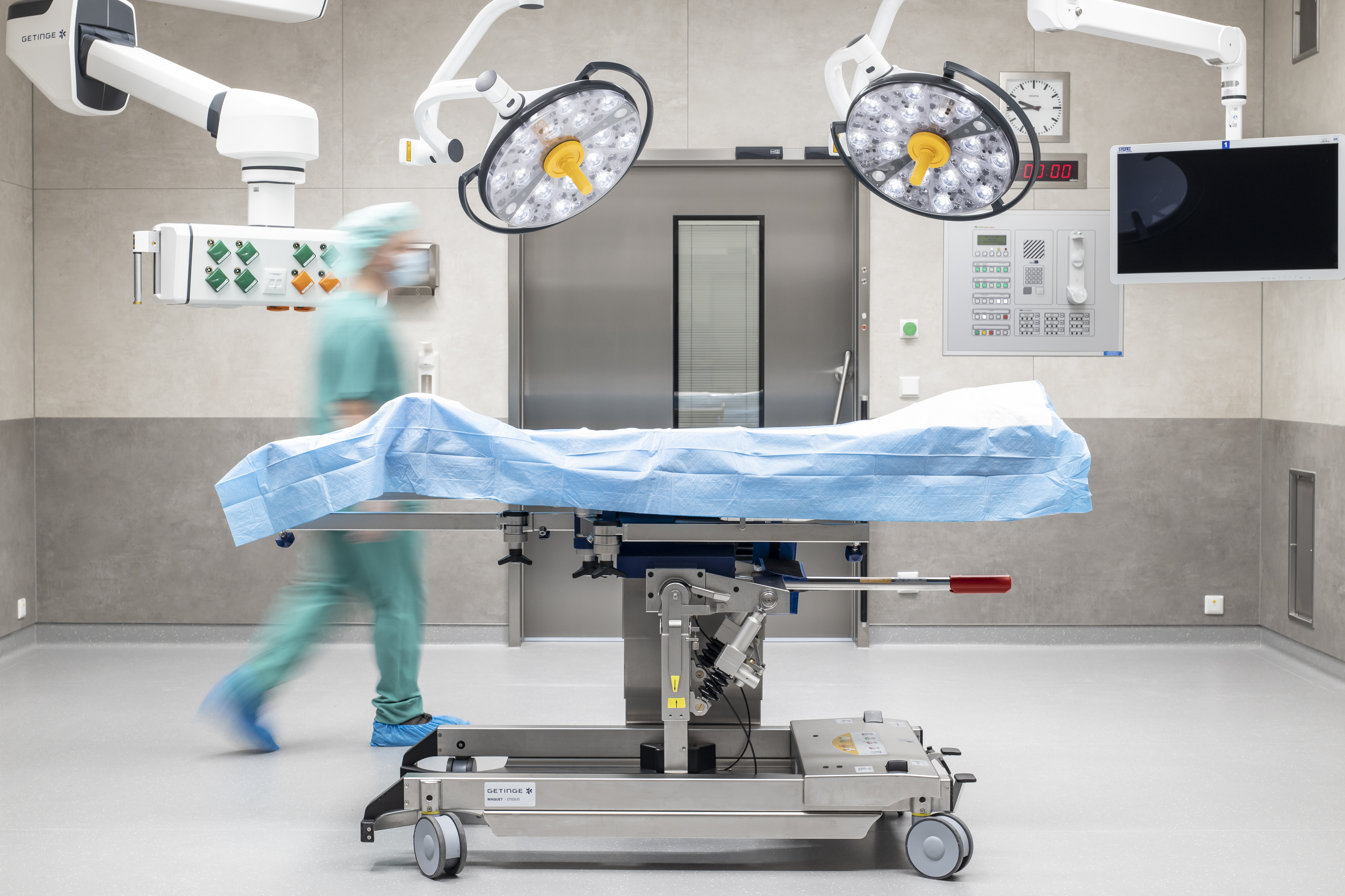 Modern operating theatre with bright, easy-care tiles on floor and walls.