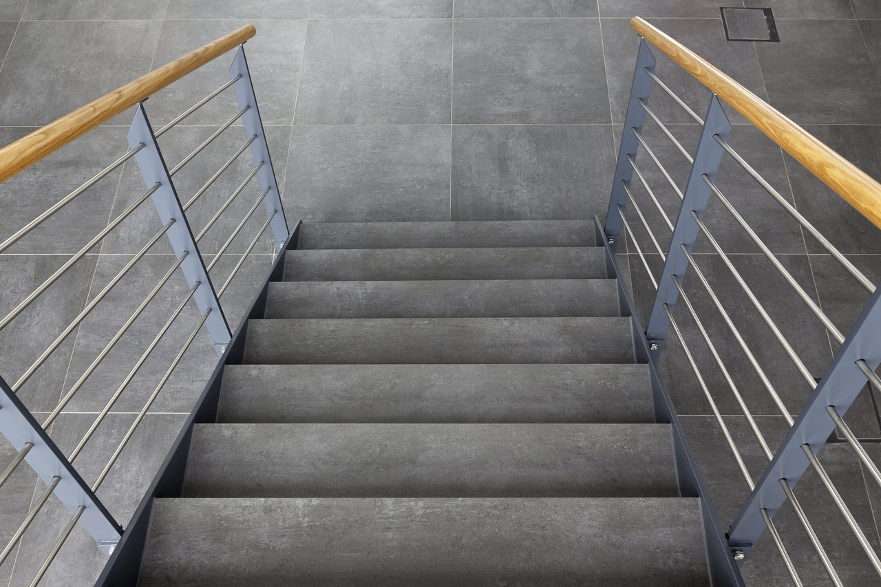 High-quality grey tiles on stairs and floor for a modern ambiance.
