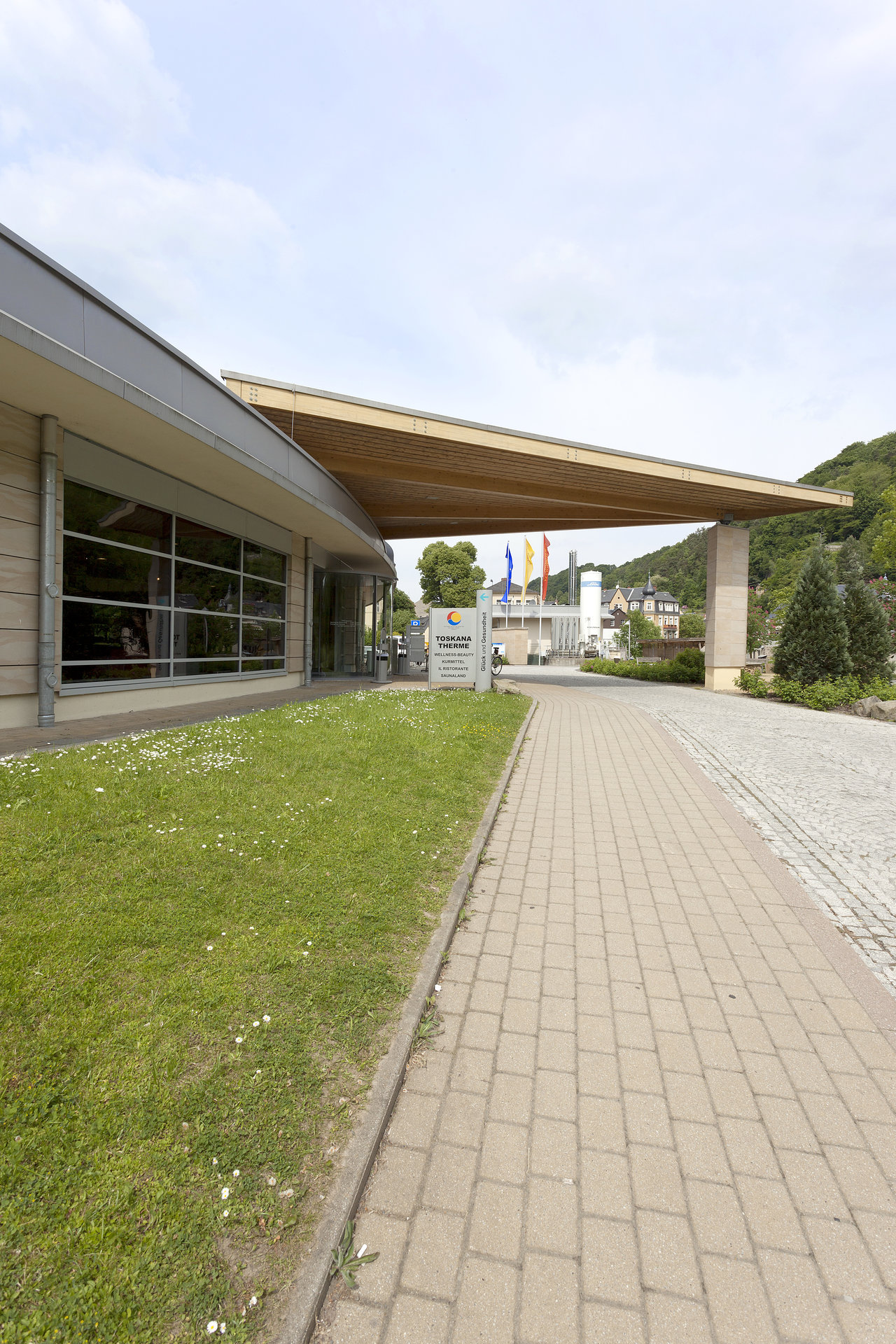 Inviting entrance with modern paving, perfect for our outdoor tiles.