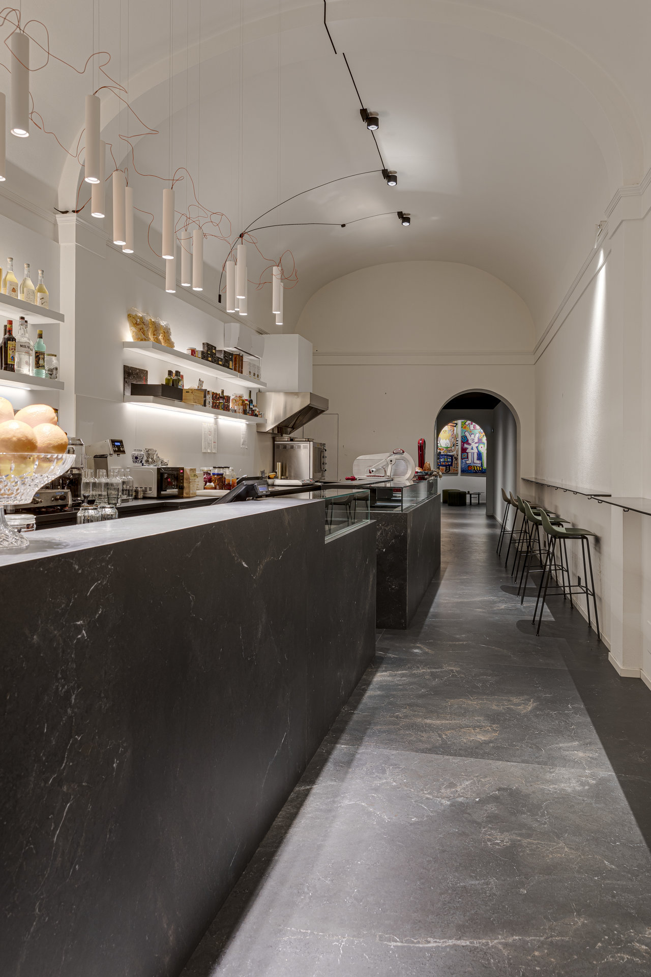 Stylish, large-format dark tiles in a modern hospitality area.