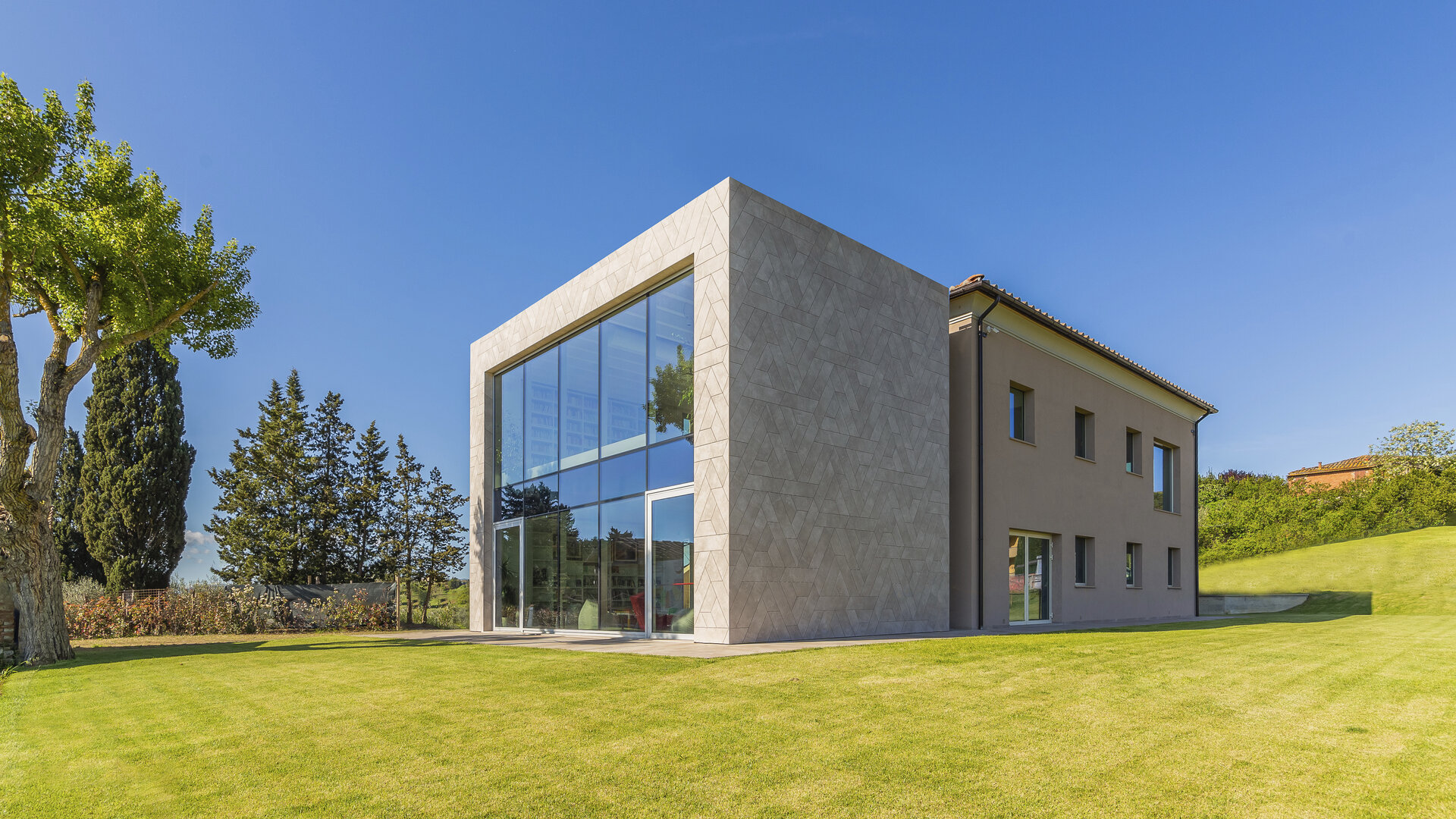 Modern building with large glass fronts and bright facade, ideal for Porcelaingres and Schöner Wohnen tiles.