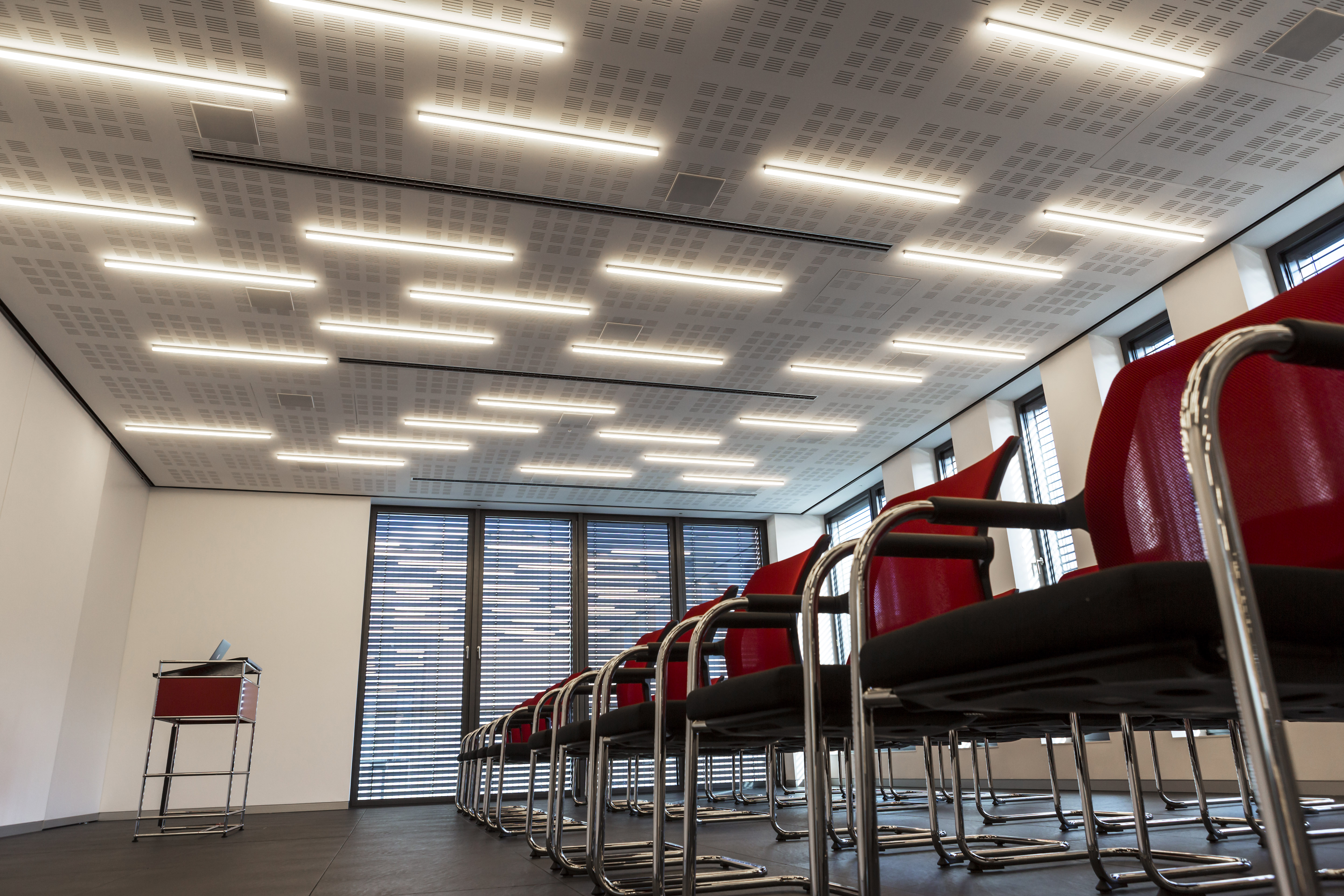Dark, modern tile floor in a stylish conference room.