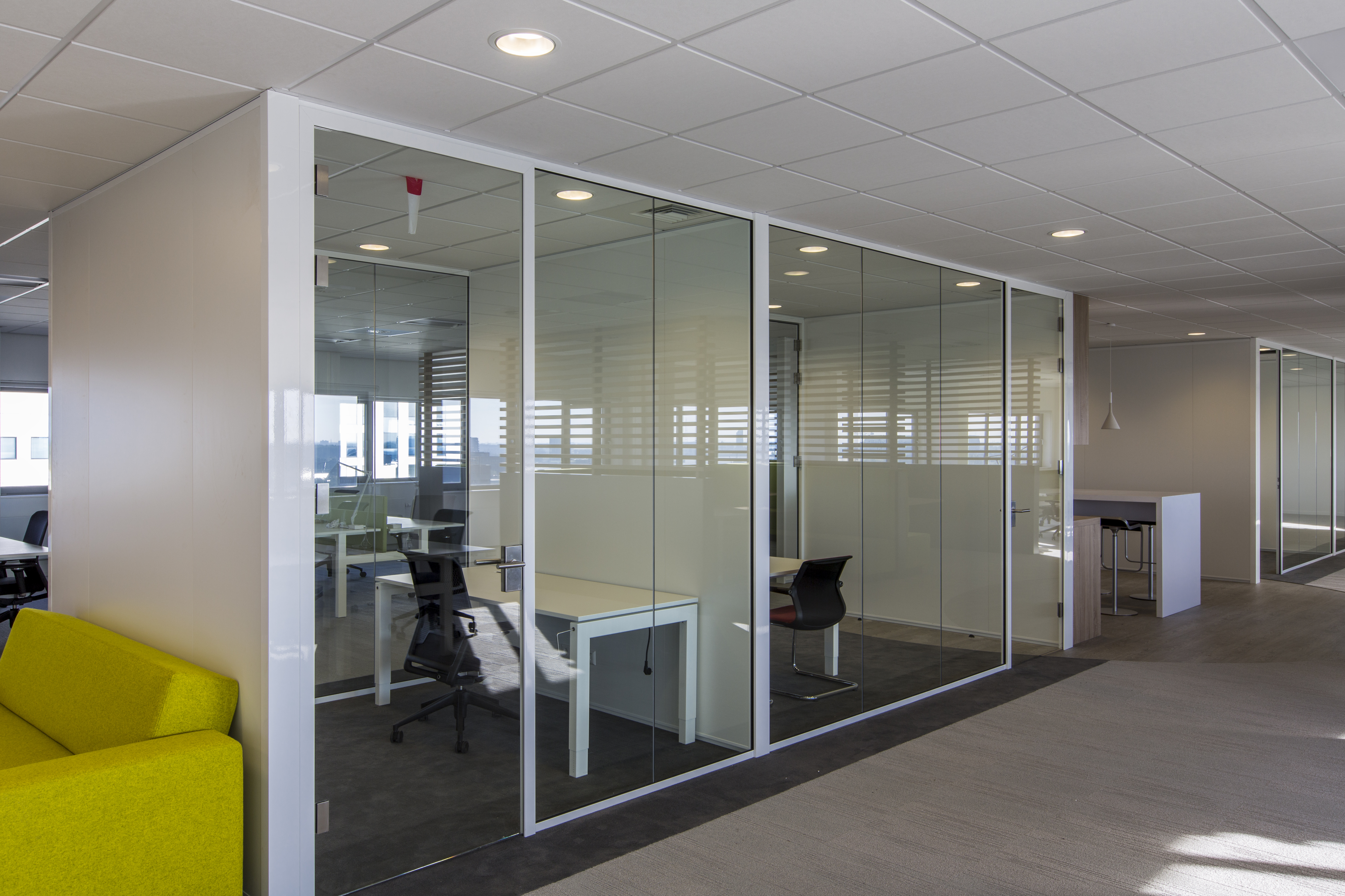 Bright offices with modern floor tiles and glass walls.