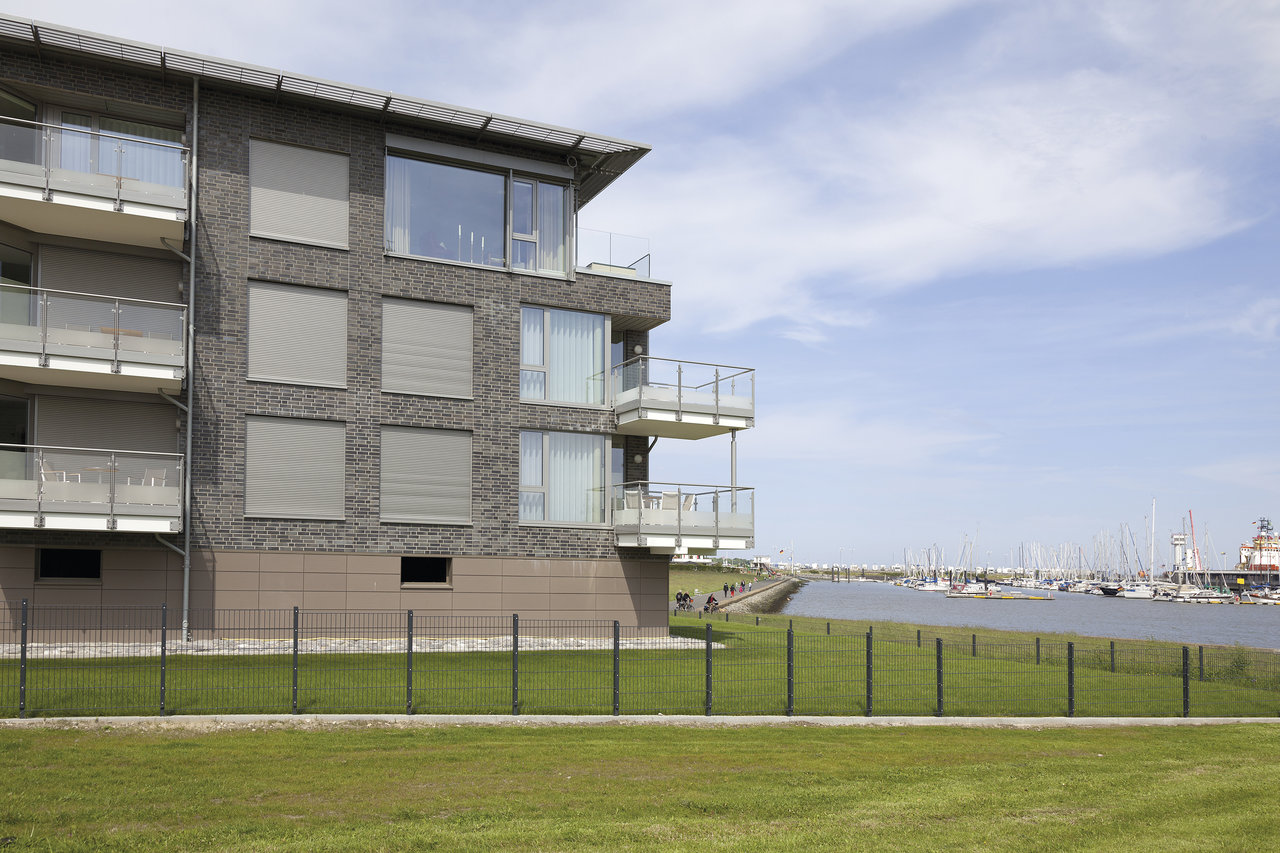 Application example: Tiles on facade and balconies of a modern house by the harbour.