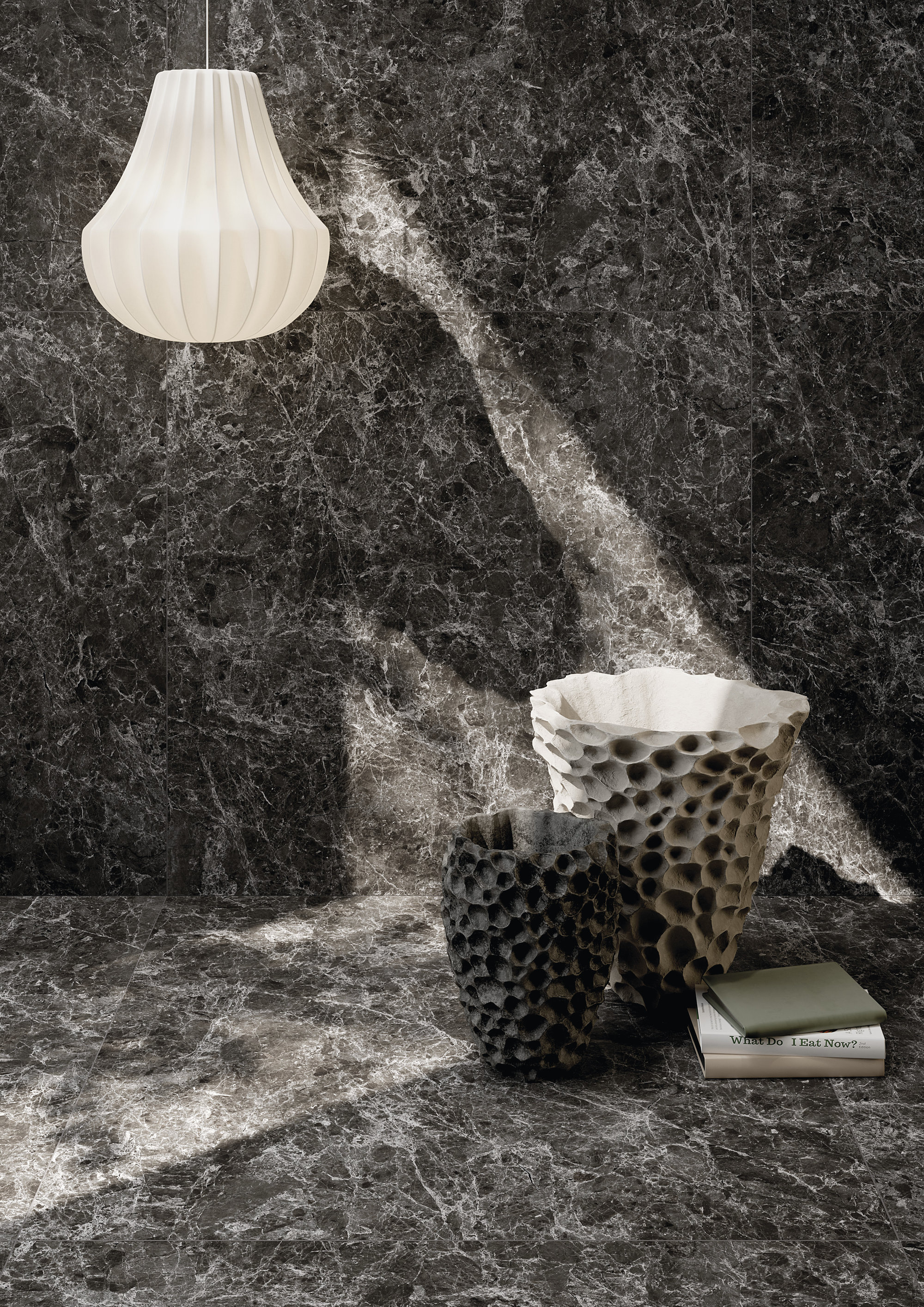 Dark marble-effect porcelain tiles on wall and floor, stylishly decorated.