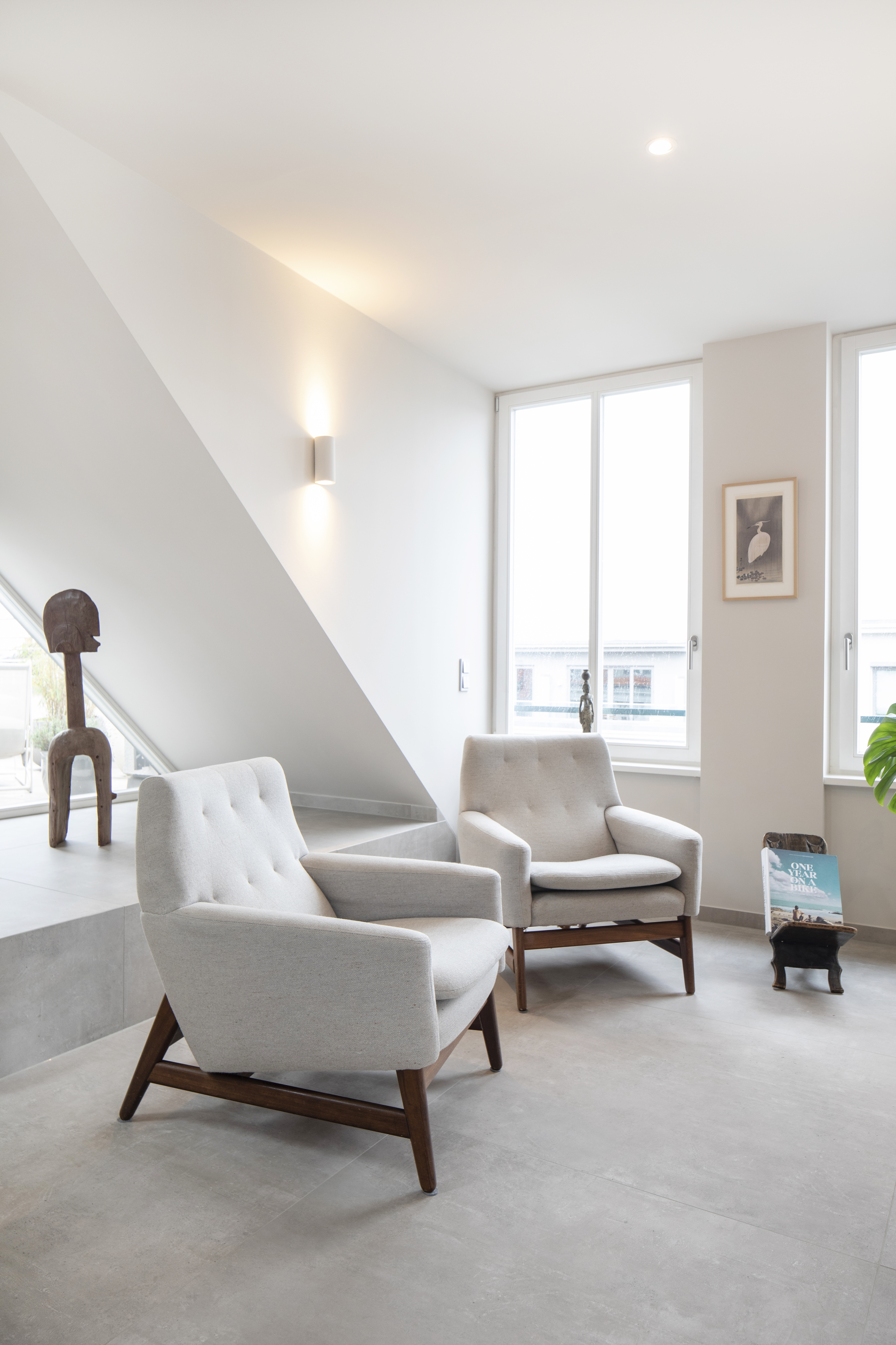Light concrete-look tiles in a modern living room.