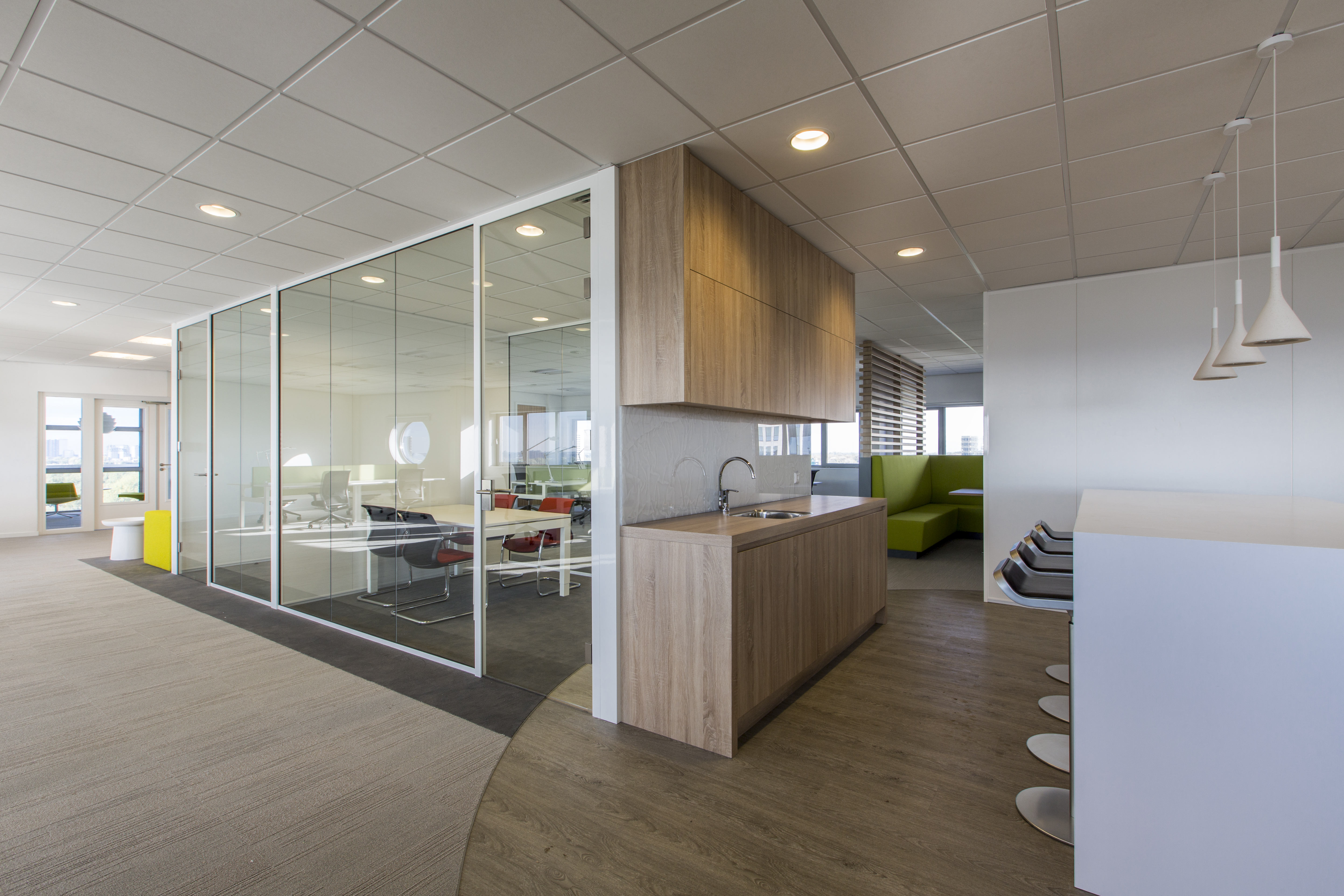 Open-plan office with stylish wood-effect tiles & carpet.