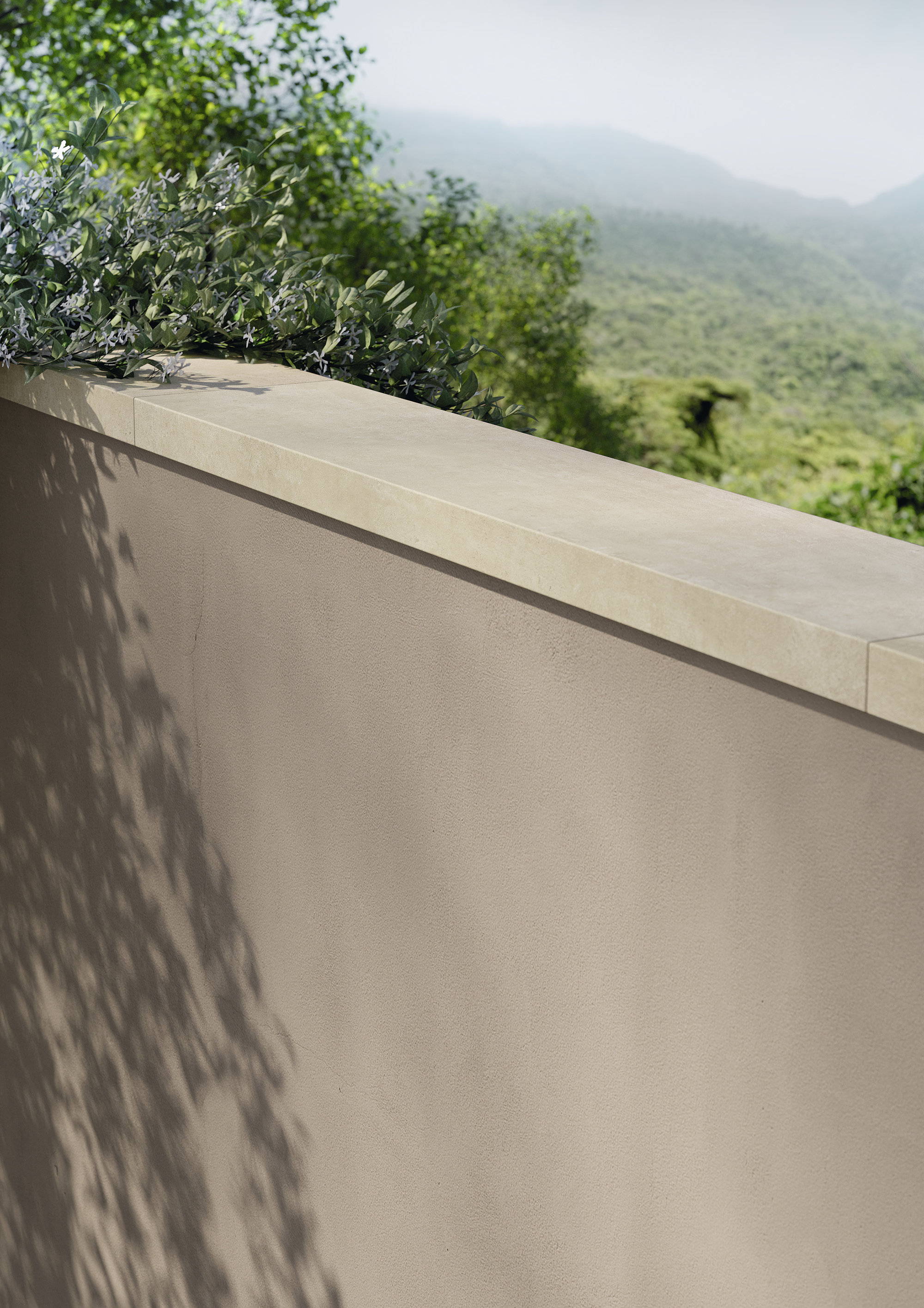 Beige outdoor tile wall coping, overlooking green hills.