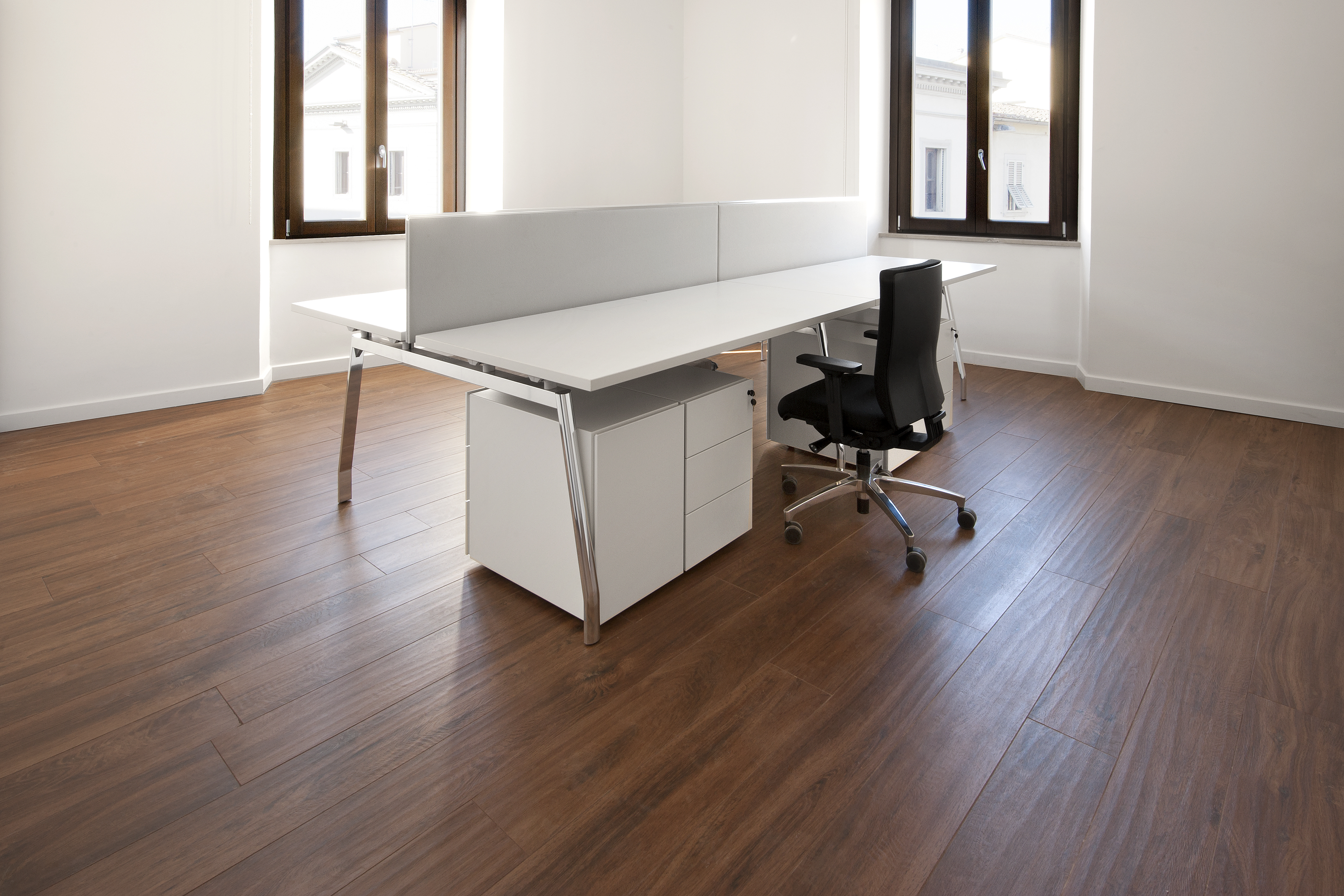High-quality indoor tiles in dark wood look in a modern office.