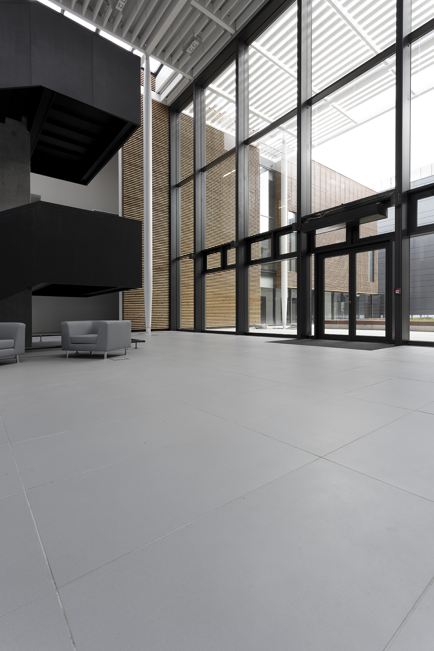 Premium light grey large format tiles in a modern setting.