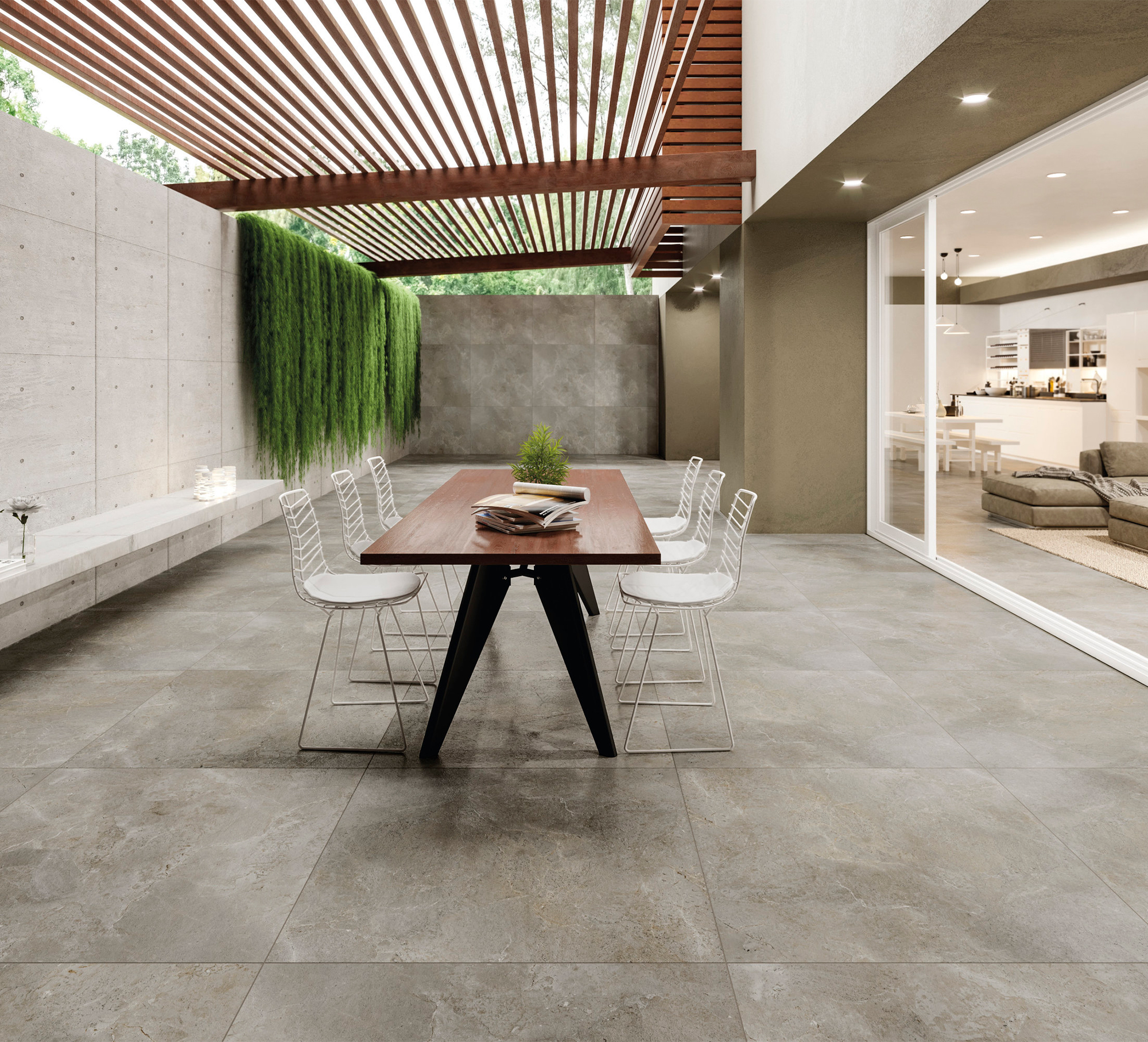Modern grey outdoor tiles on a stylish terrace with a pergola.