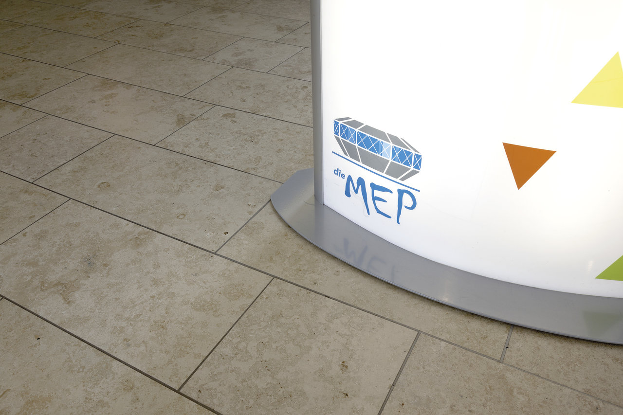 Beige floor tiles, natural stone effect.