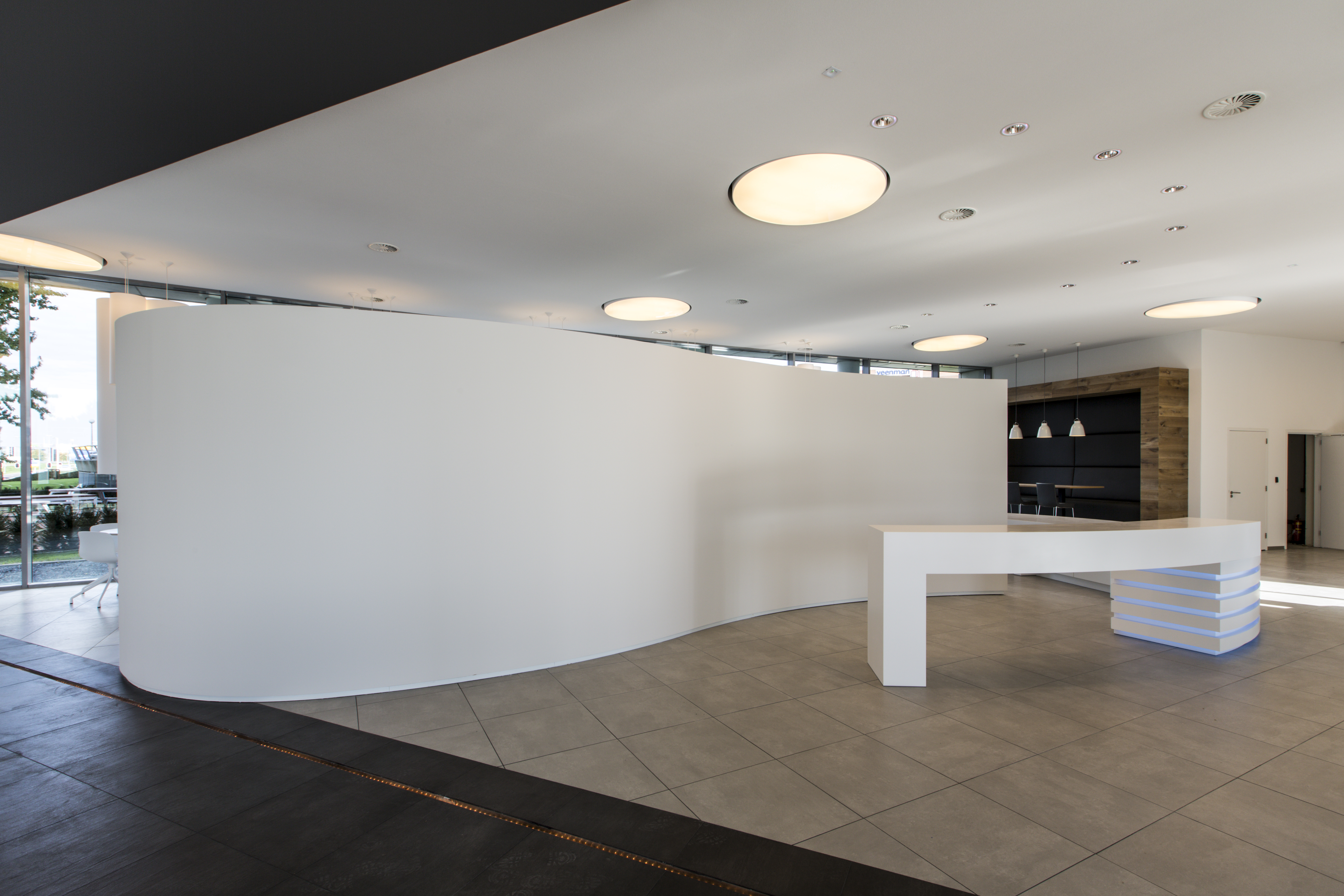 Bright, modern interior with large-format floor tiles.